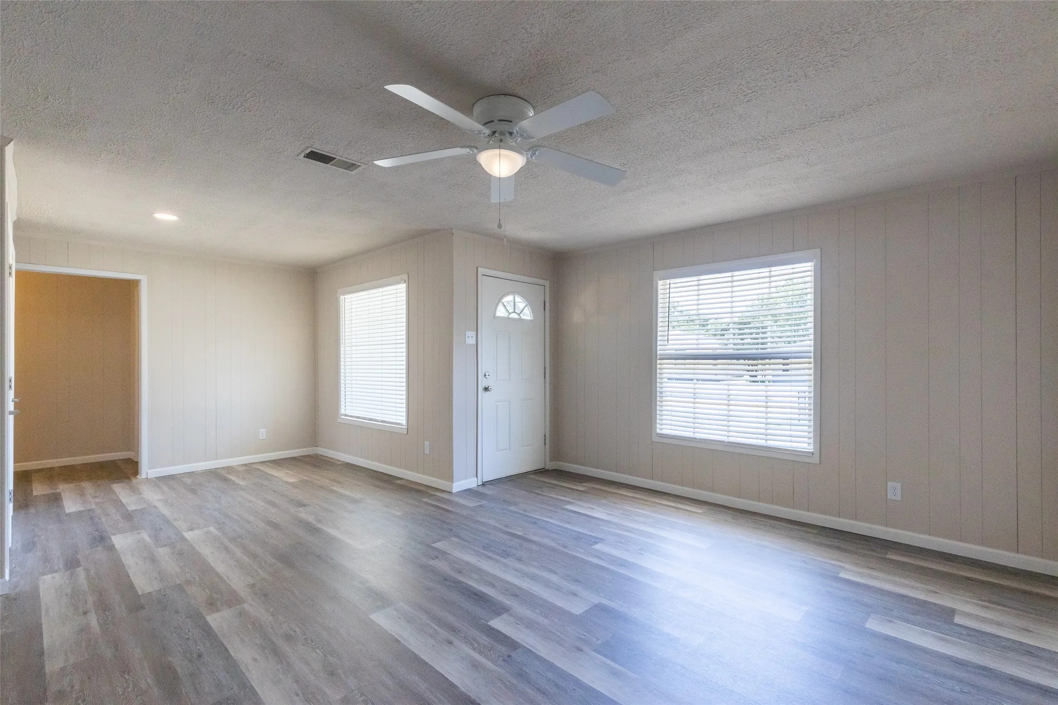 Large living area with 3 bedrooms on right and one on left