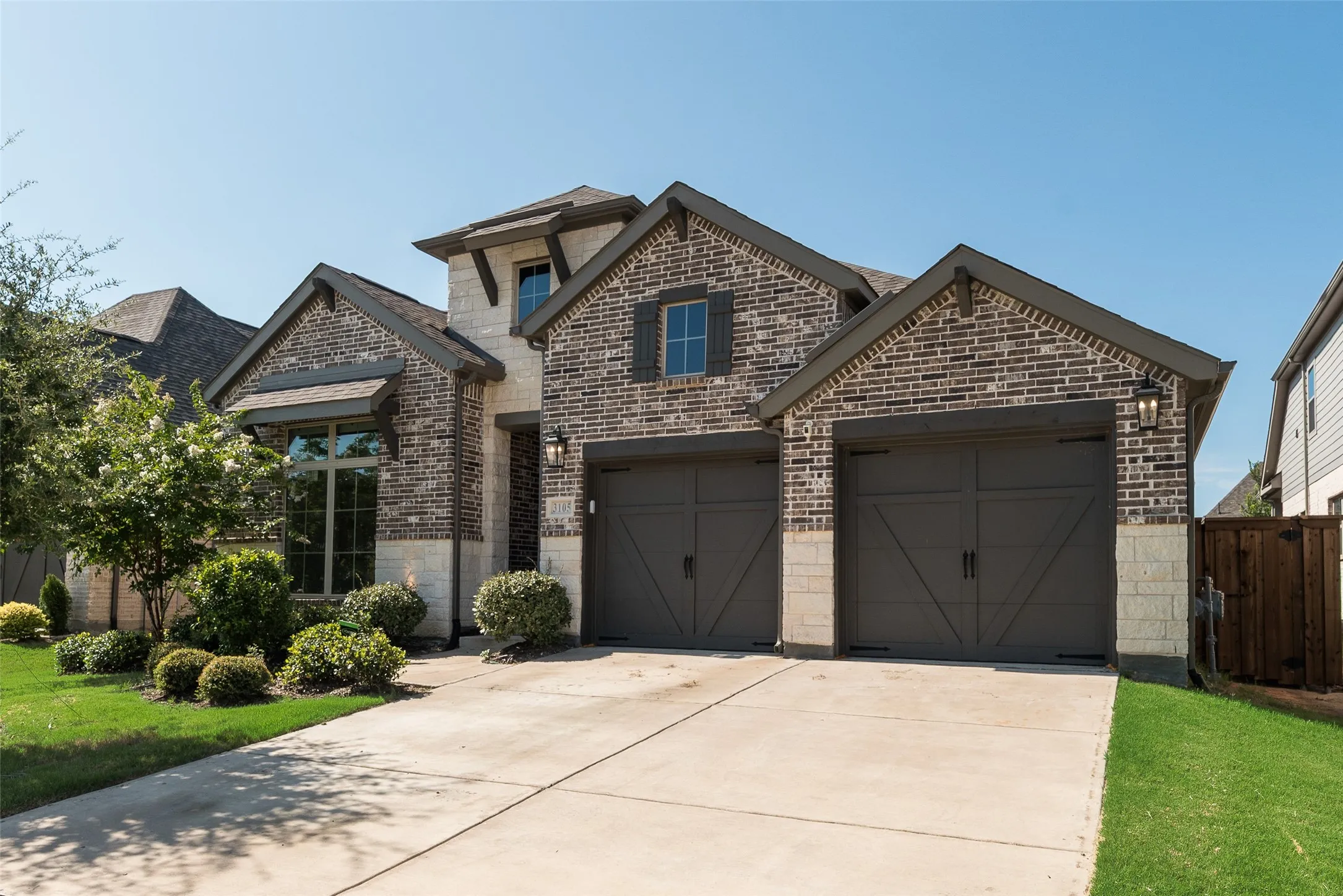 FRONT YARD MAINTENANCE BY HOA! Brick and stone facade in this beautiful home by Perry Homes!