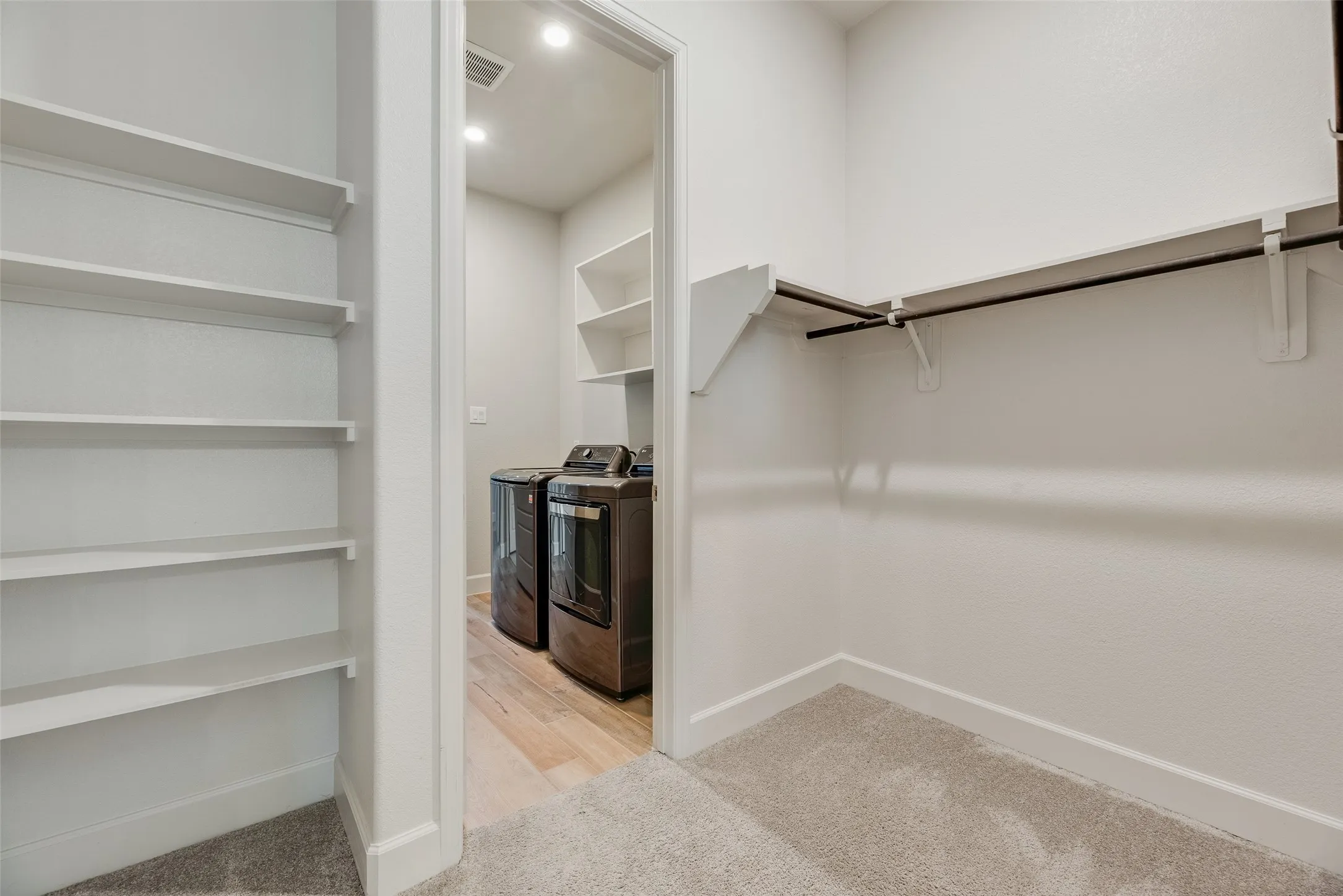 Walk-in closet is accessible to laundry room for added convenience