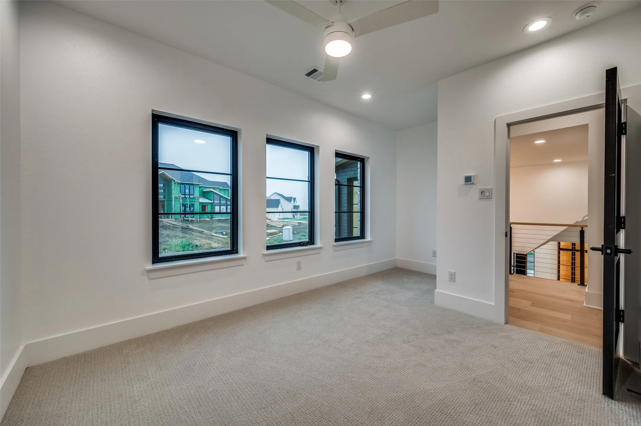 No Carpet! Area has been changed to same wood flooring as the main home.