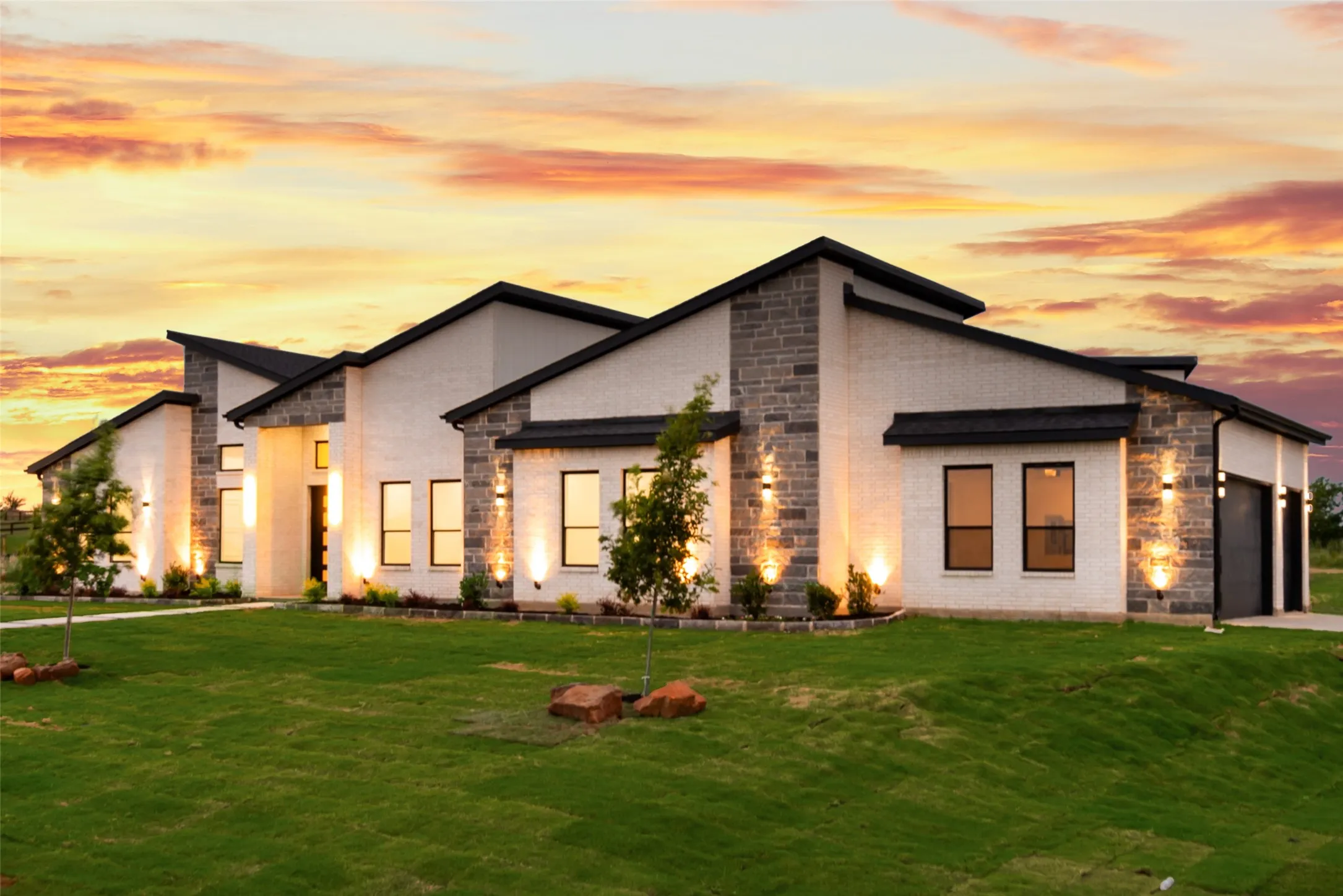 Contemporary facade featuring white brick and stone accents