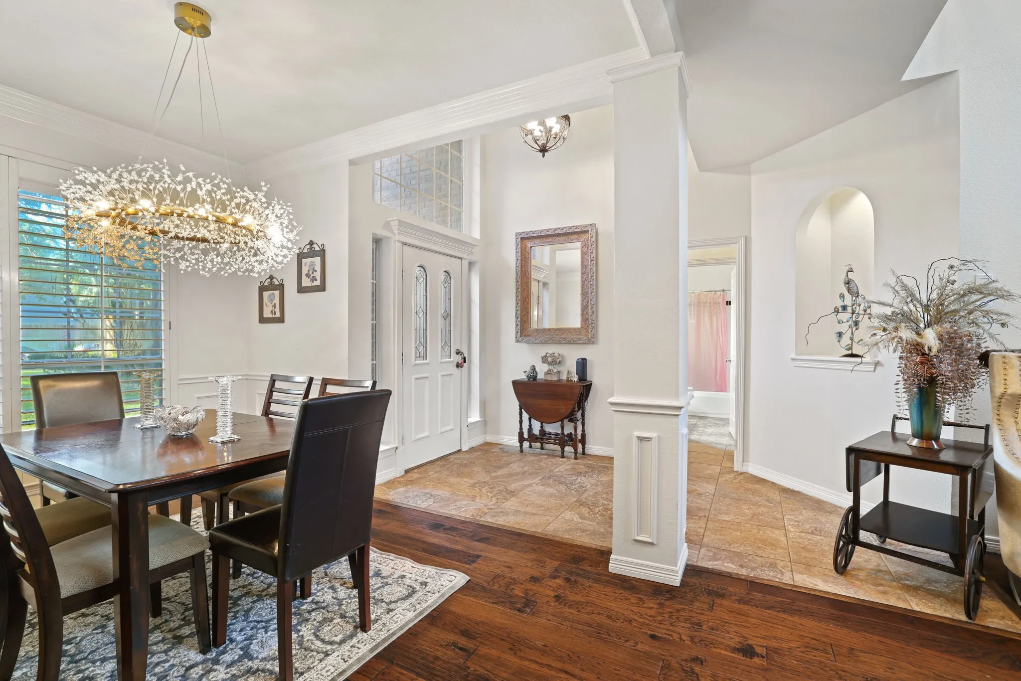 Formal dining area featuring a decorative chandelier and wood-finish flooring