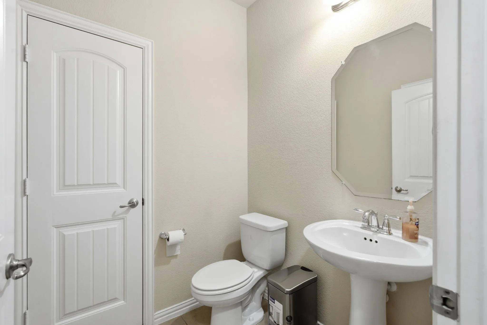 Half bath downstairs next to the laundry