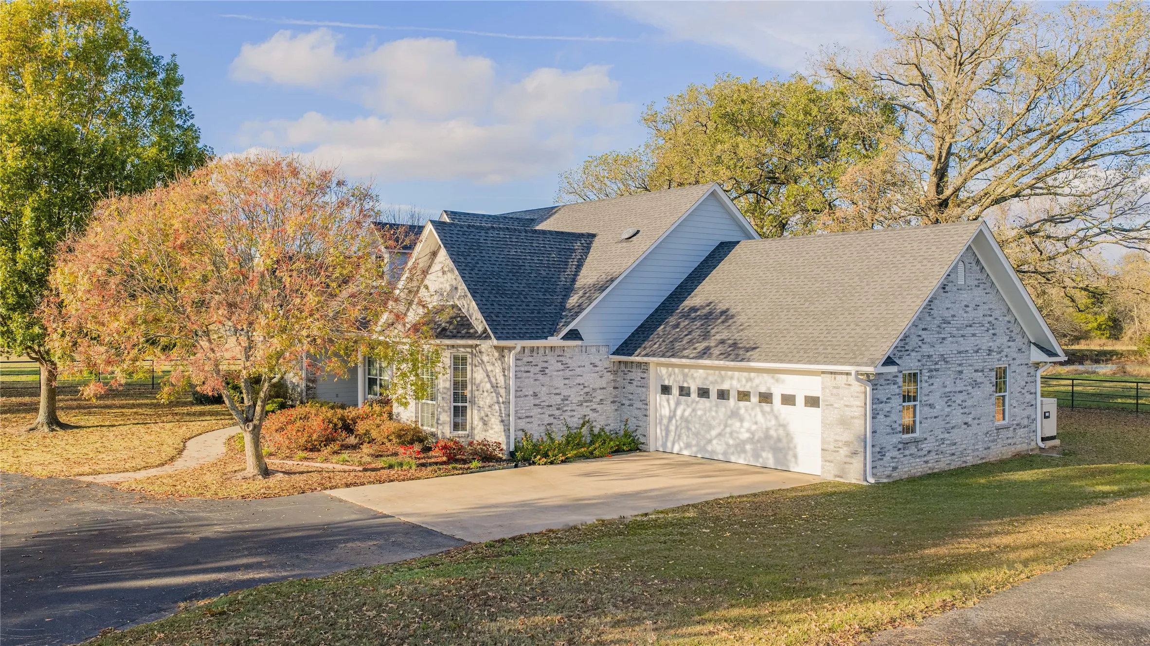 Brick and siding exterior with a multi-gabled roofline
