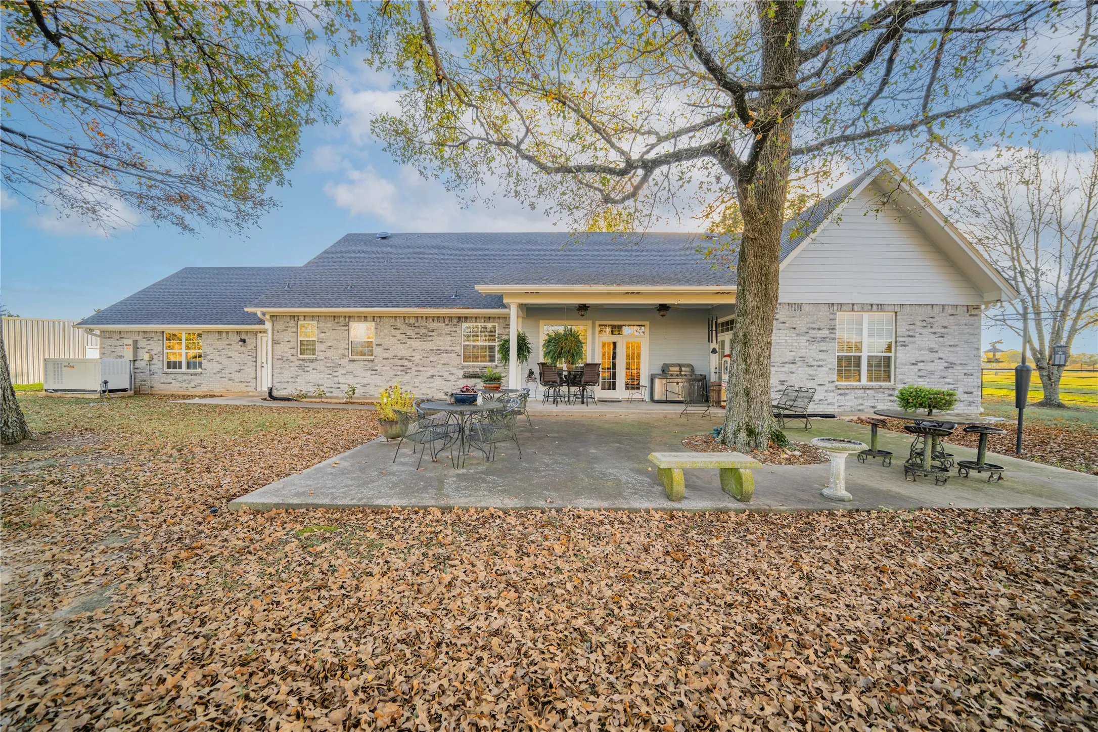 Expansive concrete patio offering ample outdoor living space