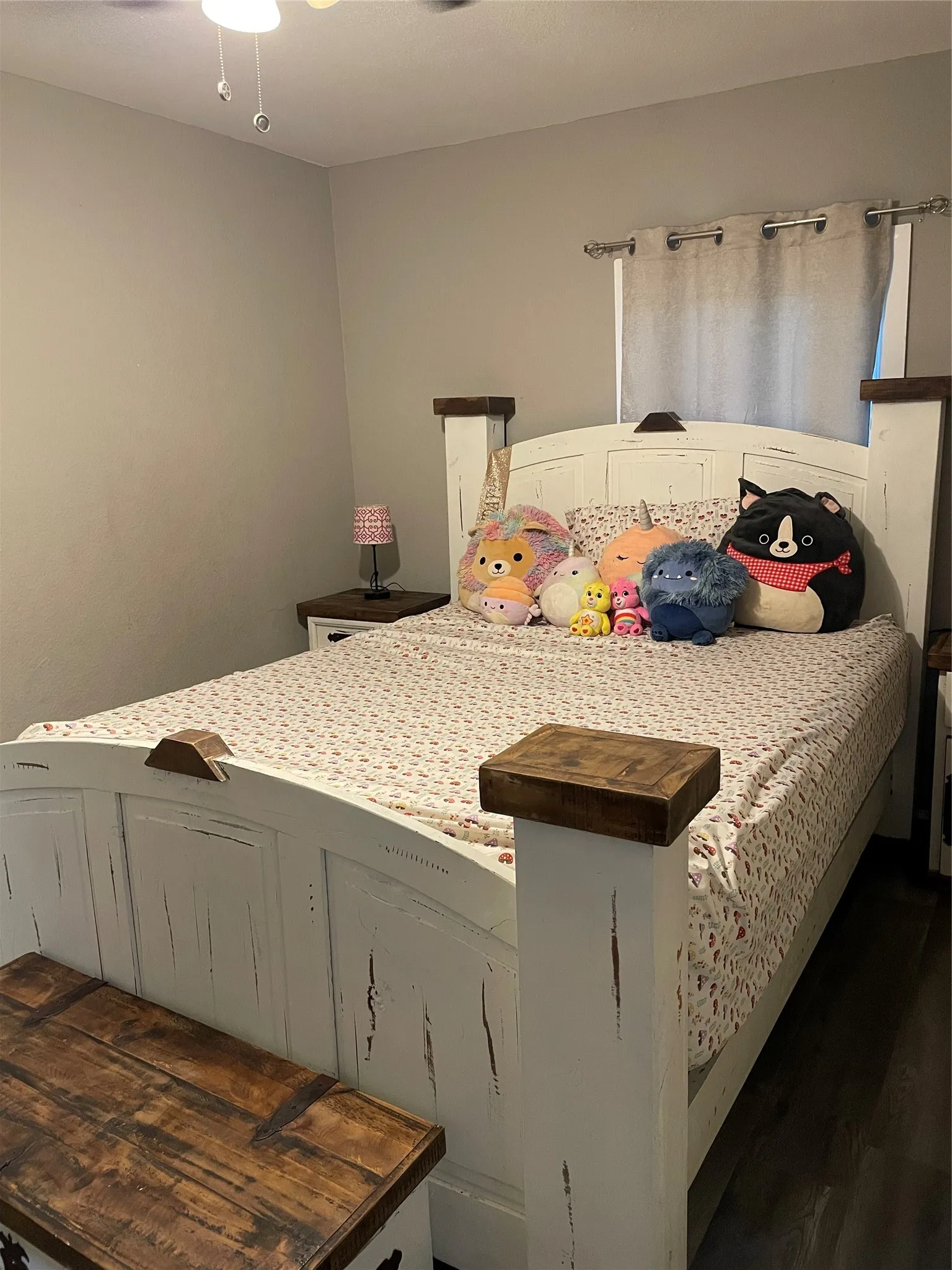 White distressed wood-finish bed frame with dark wood accents