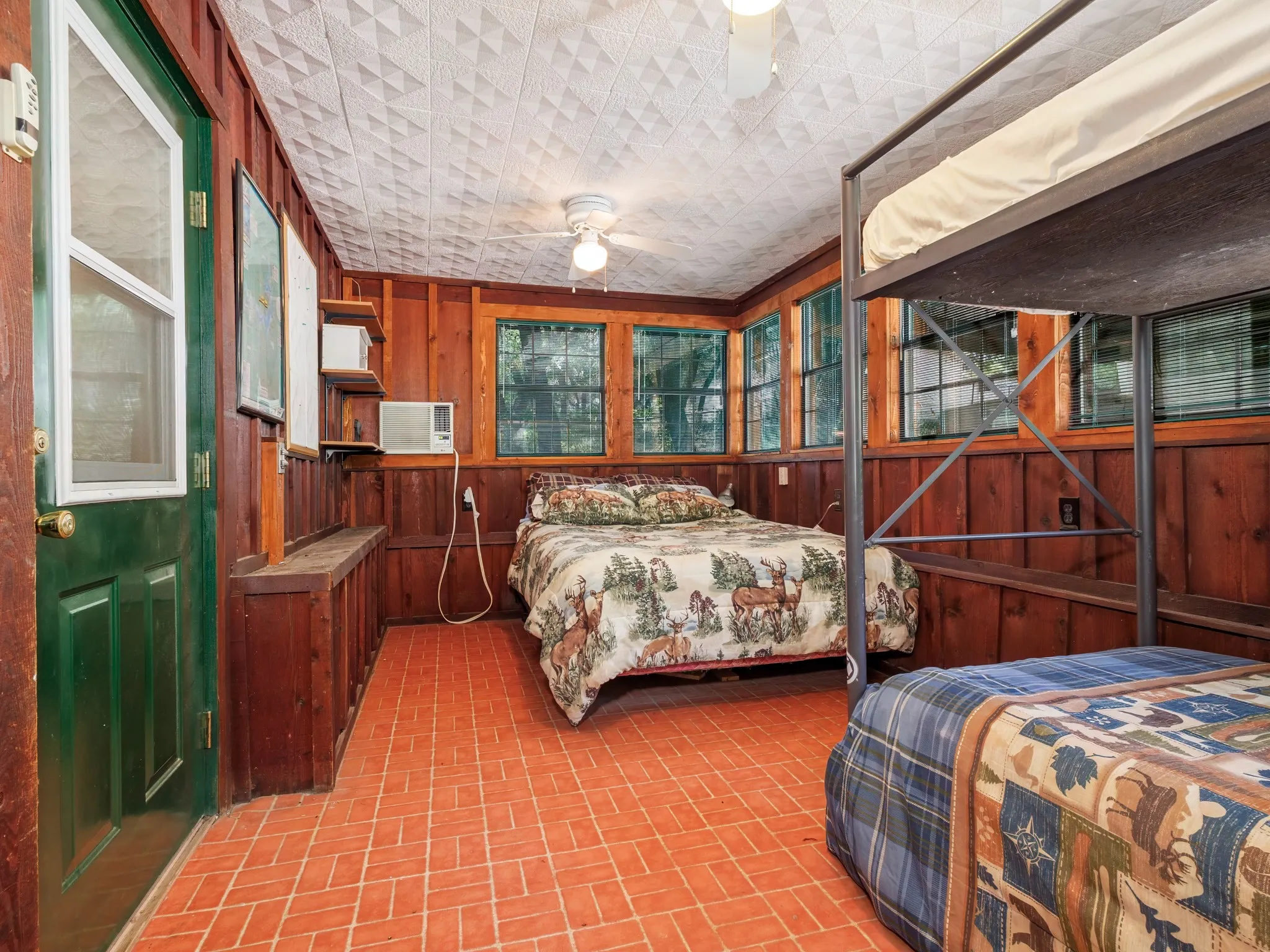 It has a wall-mounted heating and cooling unit.