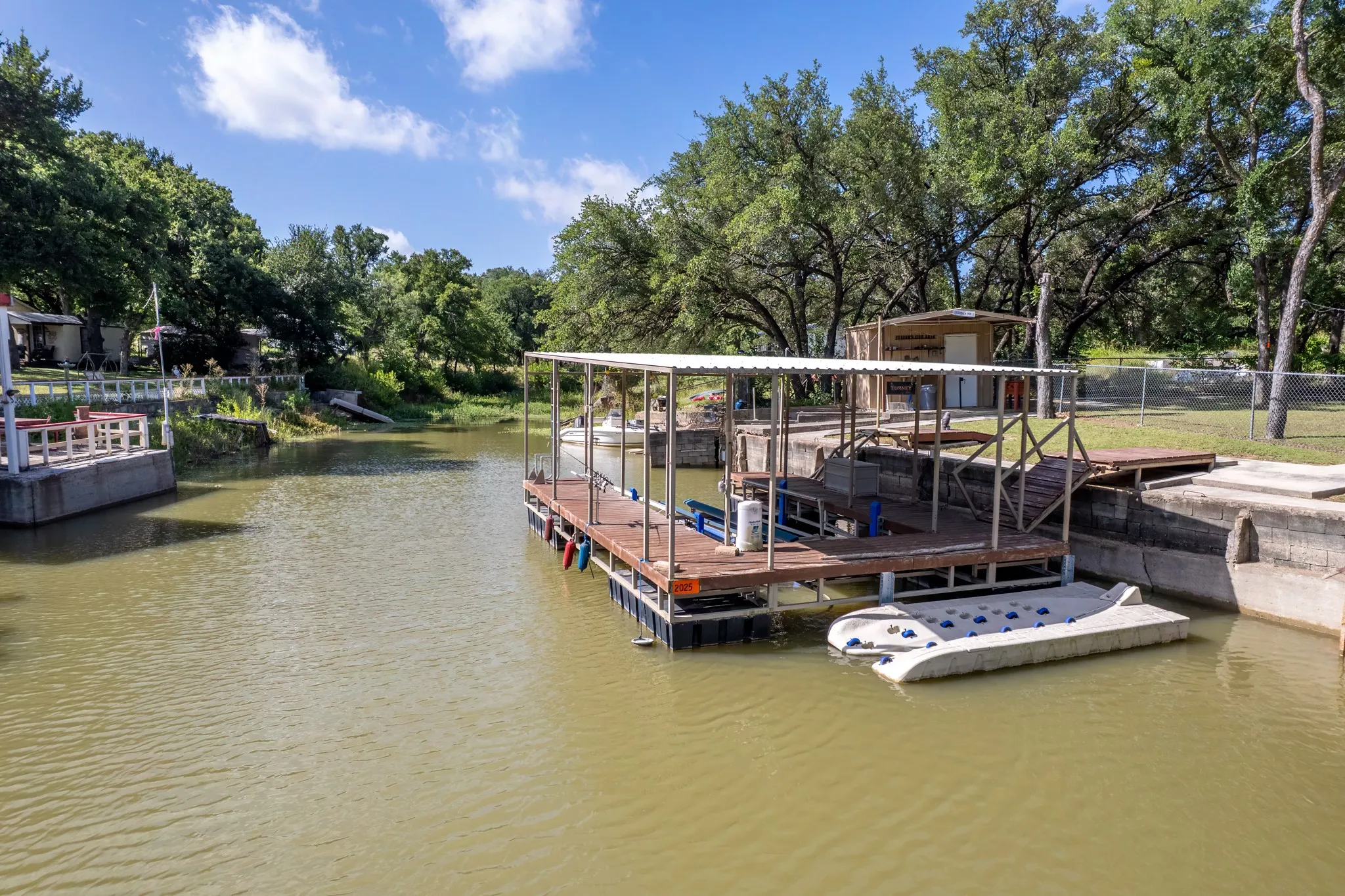 The dock is equipped with a designated area for jet ski parking and launching.