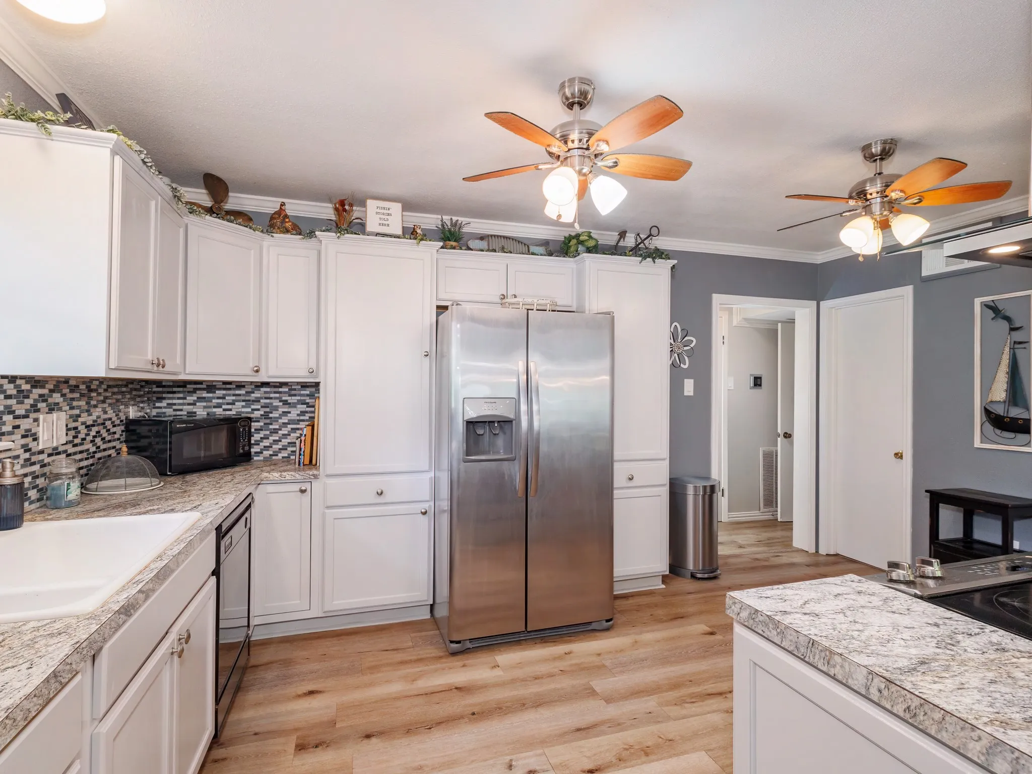 The kitchen offers an easy access to a full bath.