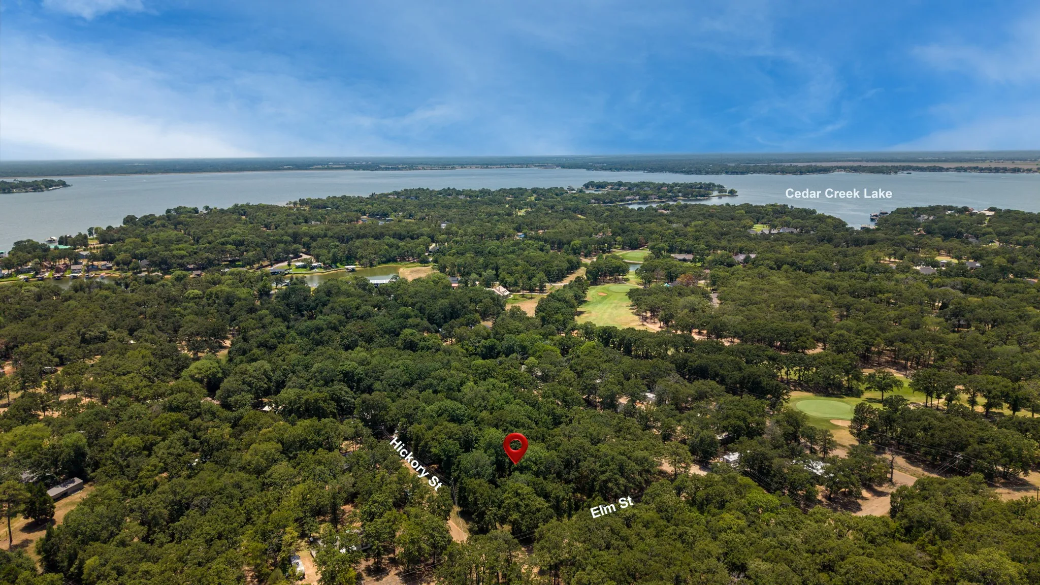 Expansive wooded lot with proximity to Cedar Creek Lake and a golf course