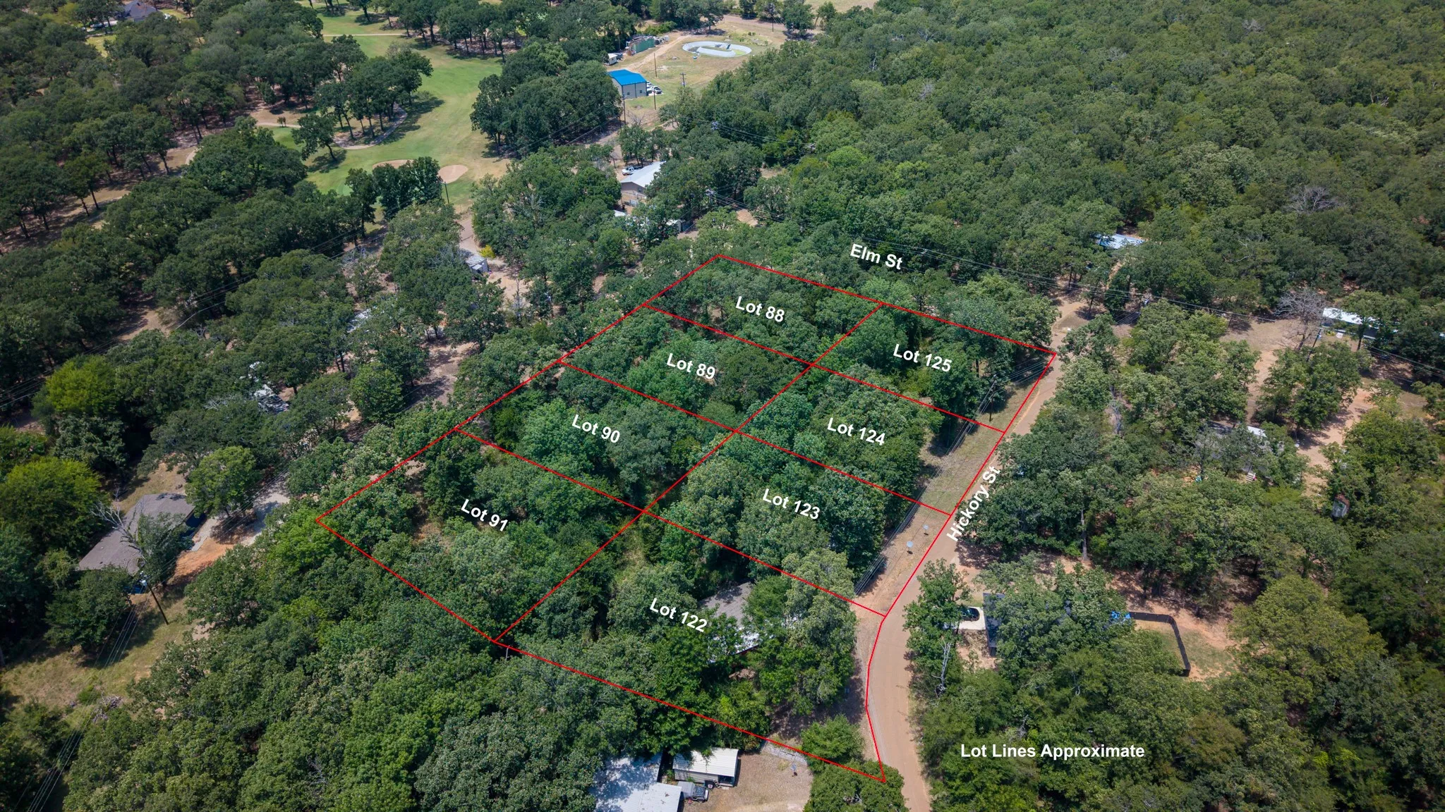 Aerial perspective showcasing multiple wooded lots