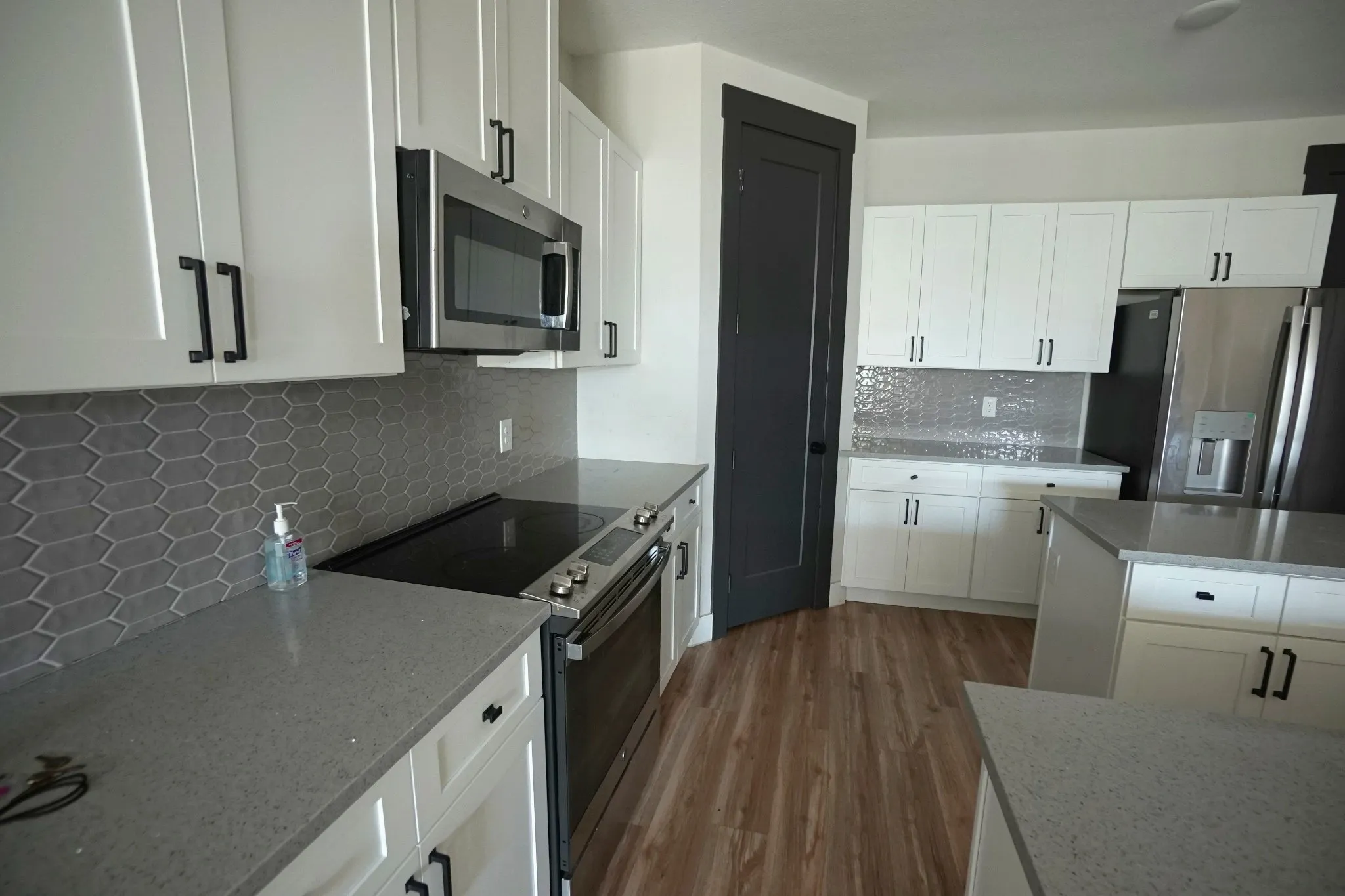 White cabinetry with matte black hardware