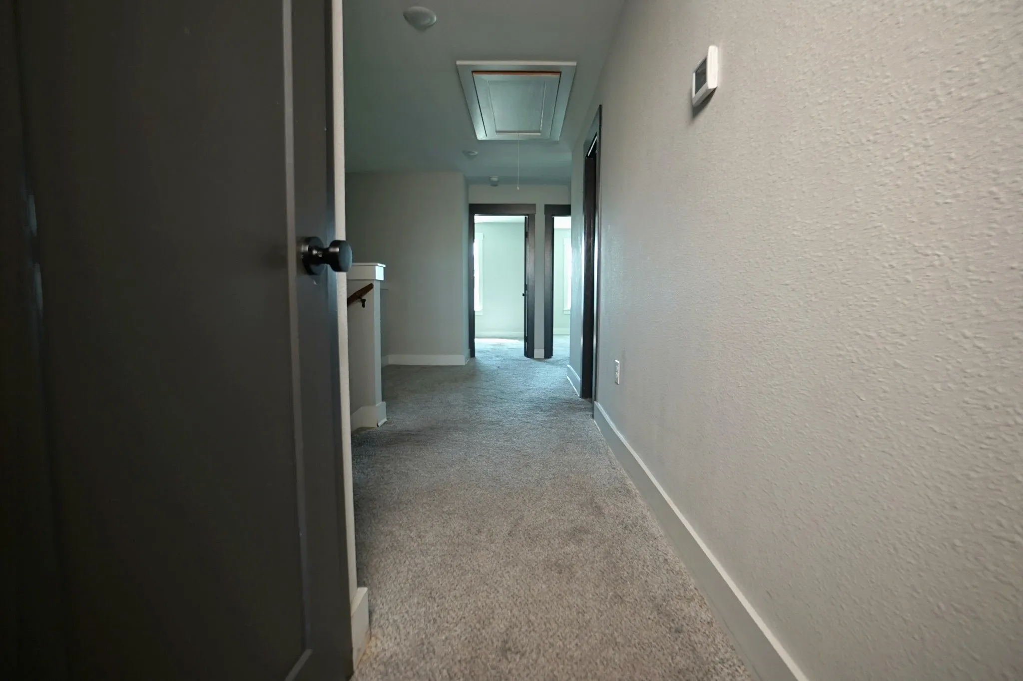 Plush carpet flooring, neutral wall tones, and recessed lighting