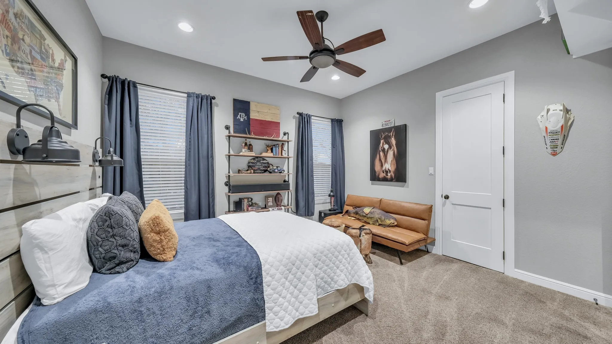 Carpeted room featuring a ceiling fan with wood-finish blades, recessed lighting, and a white interior door