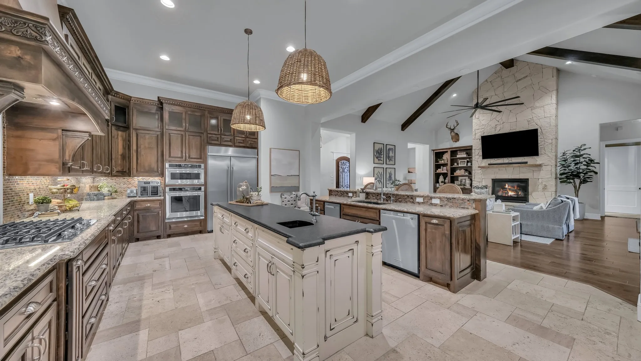 Gourmet kitchen featuring a gas range, double ovens, and stainless steel French door refrigerator
