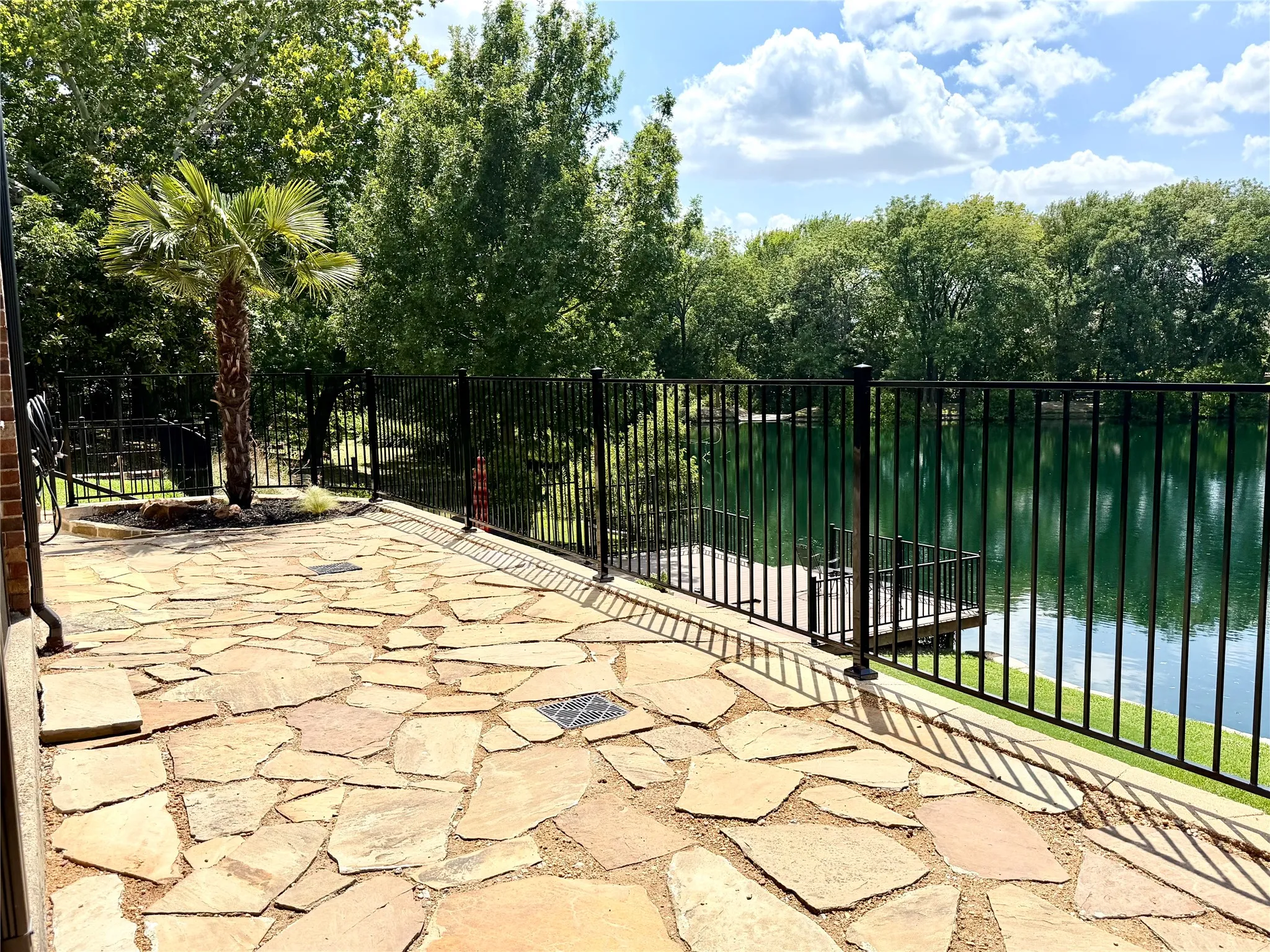 Owner has added the wrought iron fence on the right side of the backyard after pictures were taken.