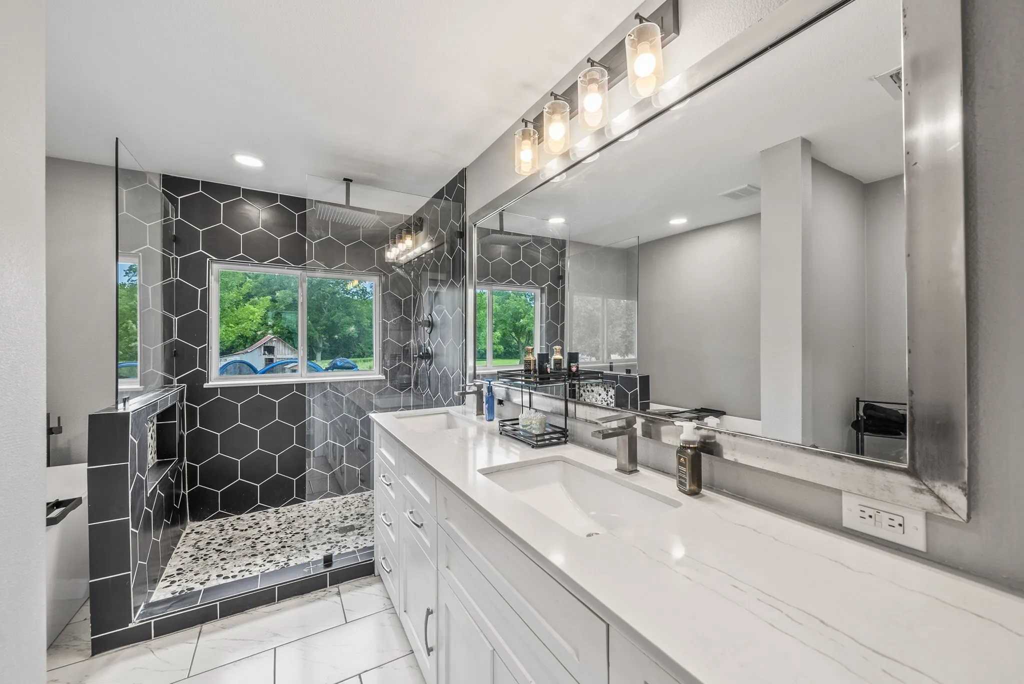 Dual vanity featuring white shaker cabinetry, an integrated white countertop, and brushed nickel faucets