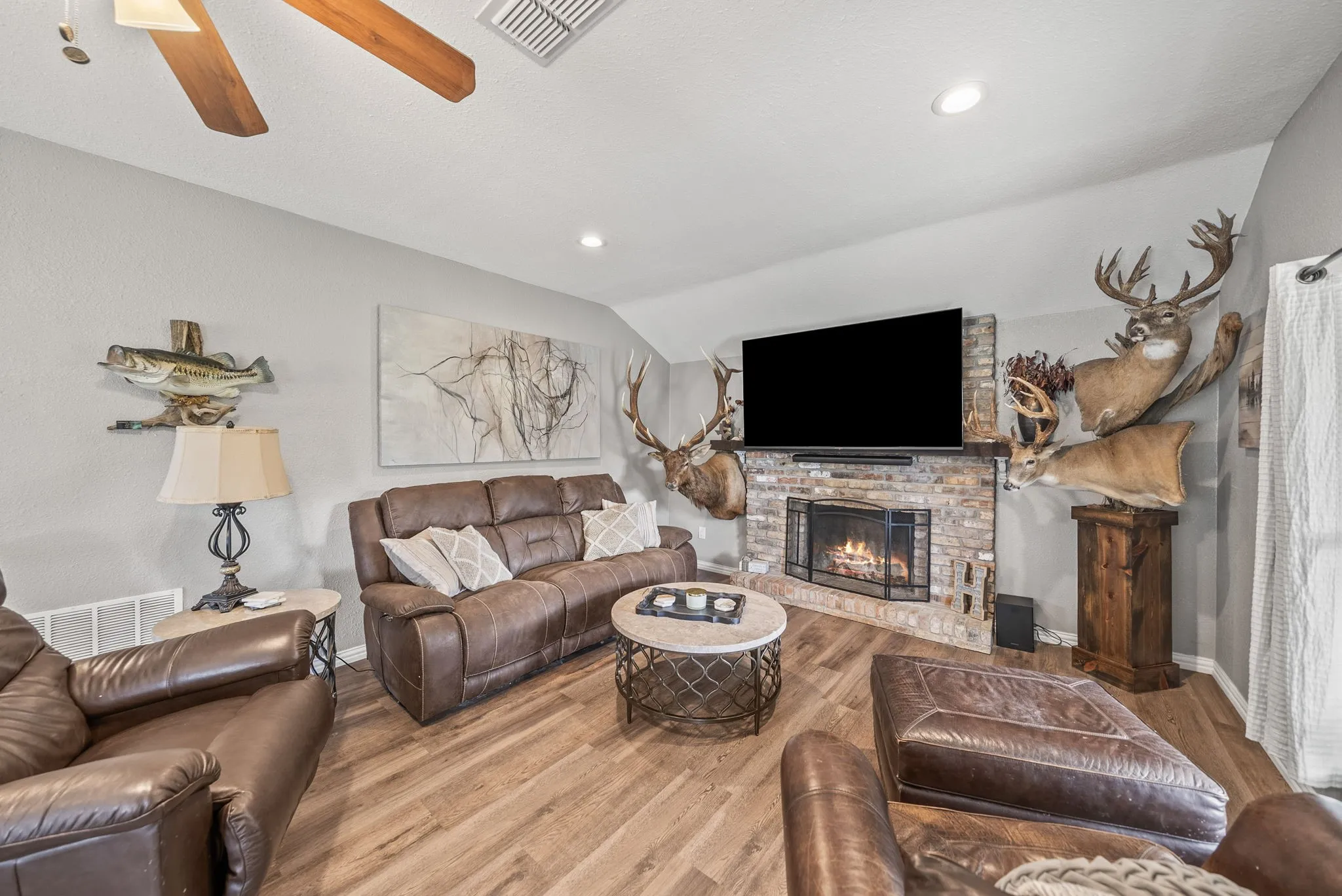 Living area featuring wood-finish flooring and light gray walls