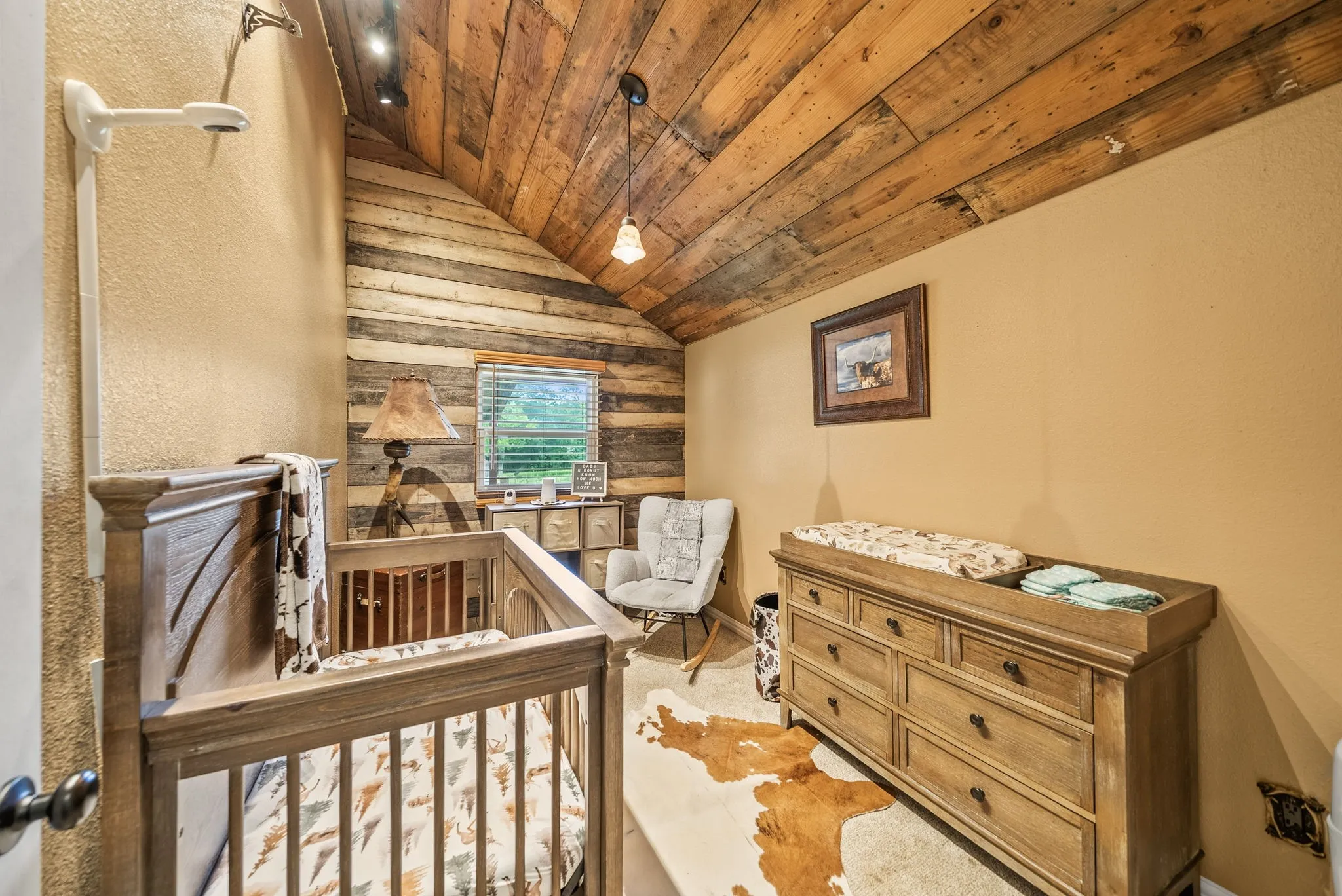 Vaulted wood-plank ceiling with recessed lighting