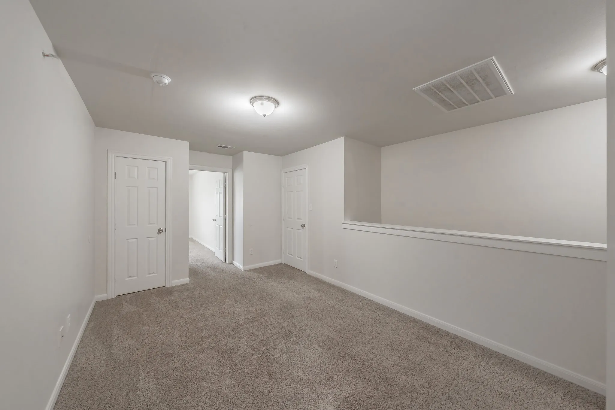 As you enter upstairs , you have this space with two storage closets