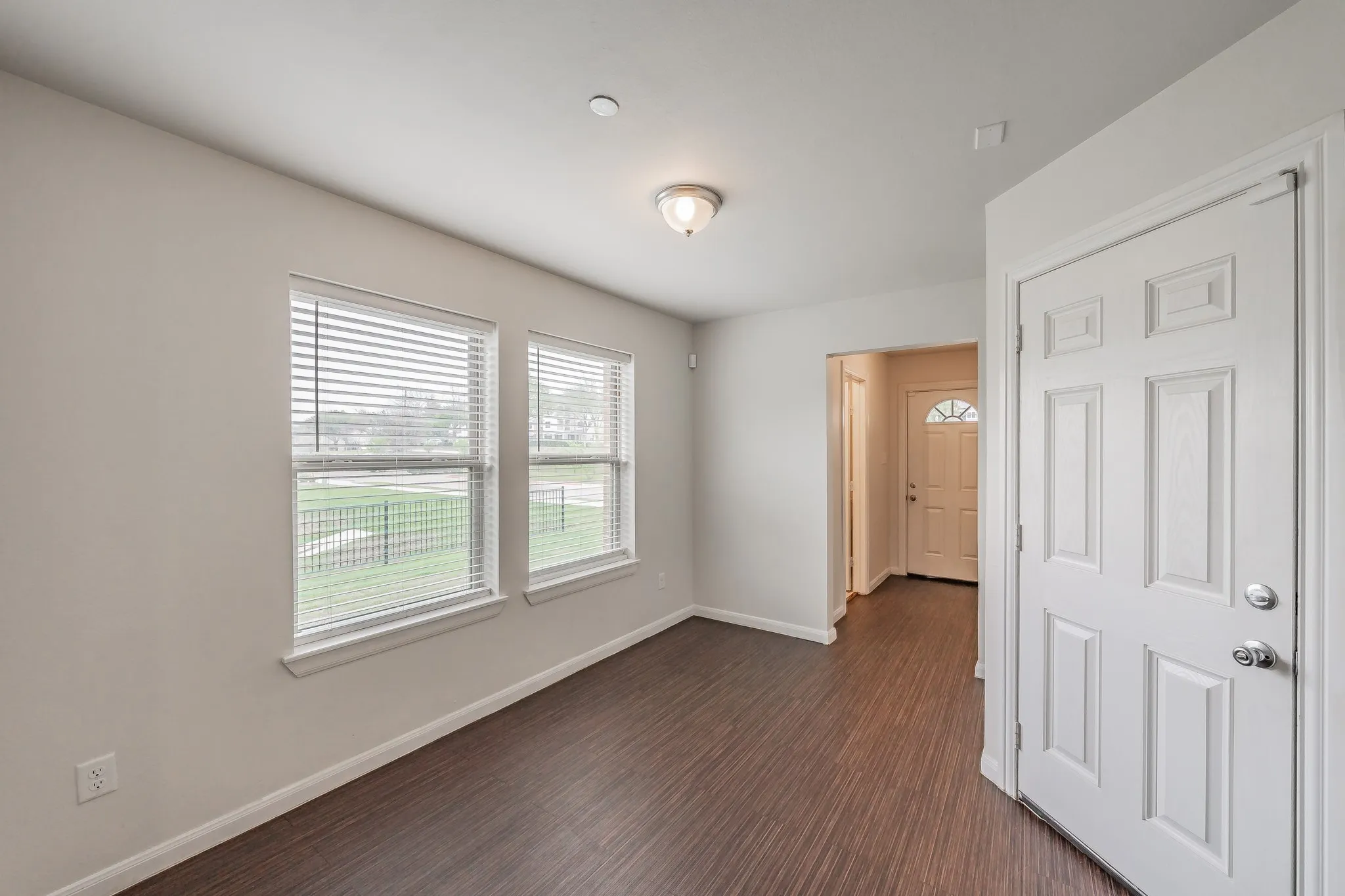 Beautiful luxury vinyl flooring downstairs. Half bathroom in entry hallway .
