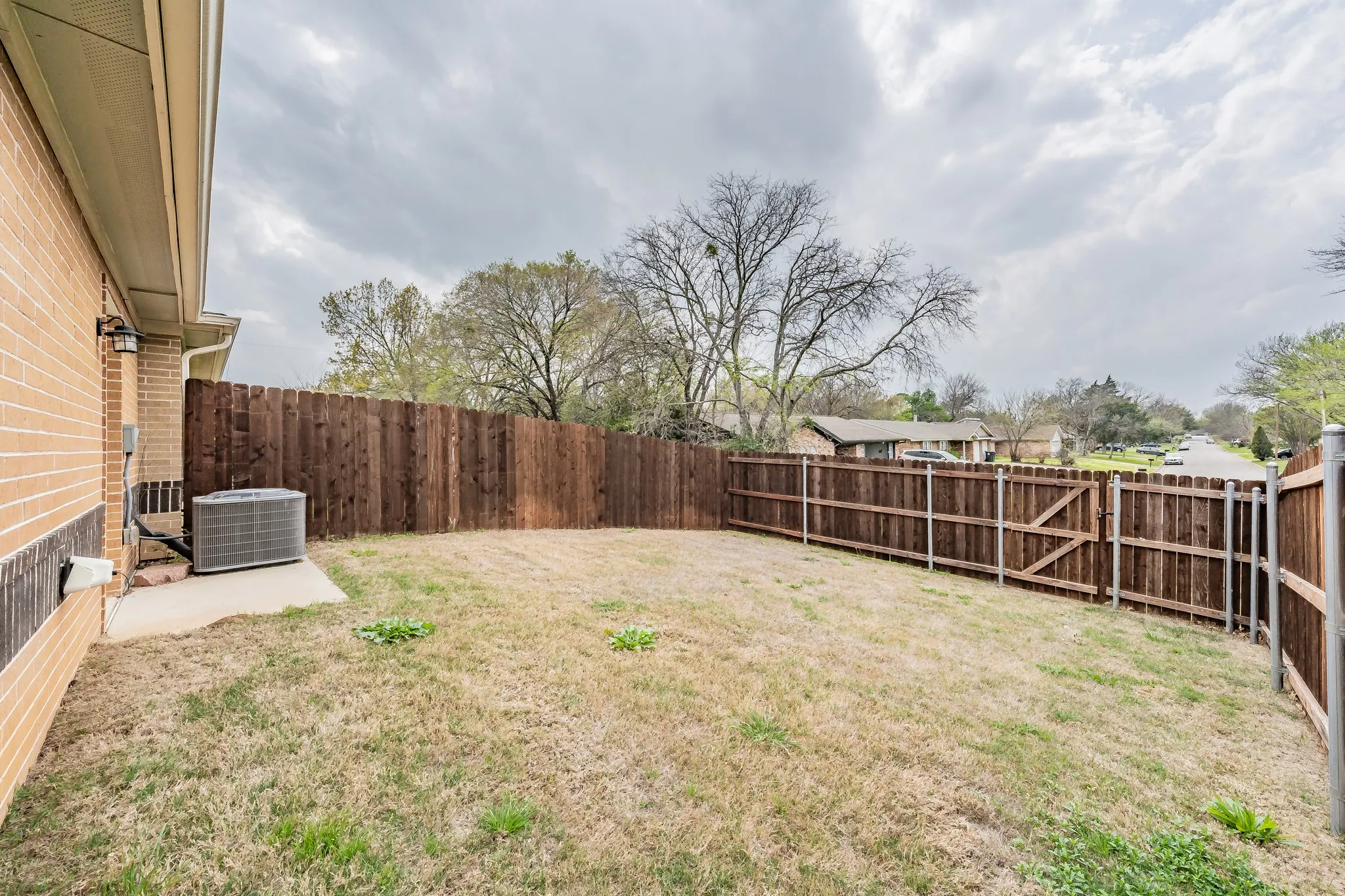 Backyard has a gate that opens up