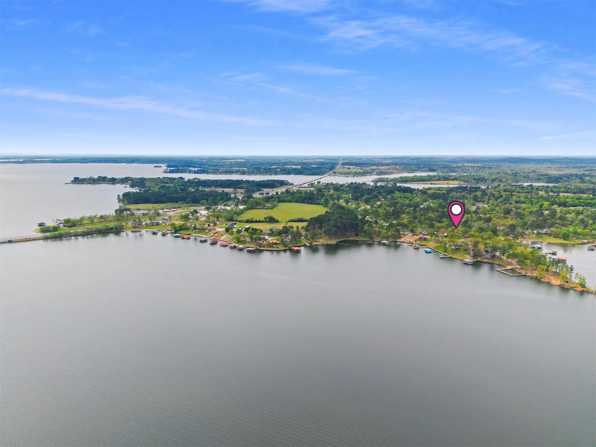 Aerial perspective showcasing a broad expanse of water with a distinct shoreline