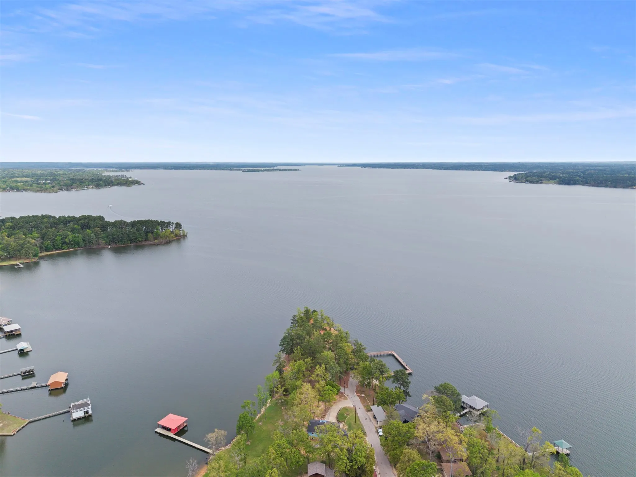 Expansive lake with multiple docks and shoreline properties