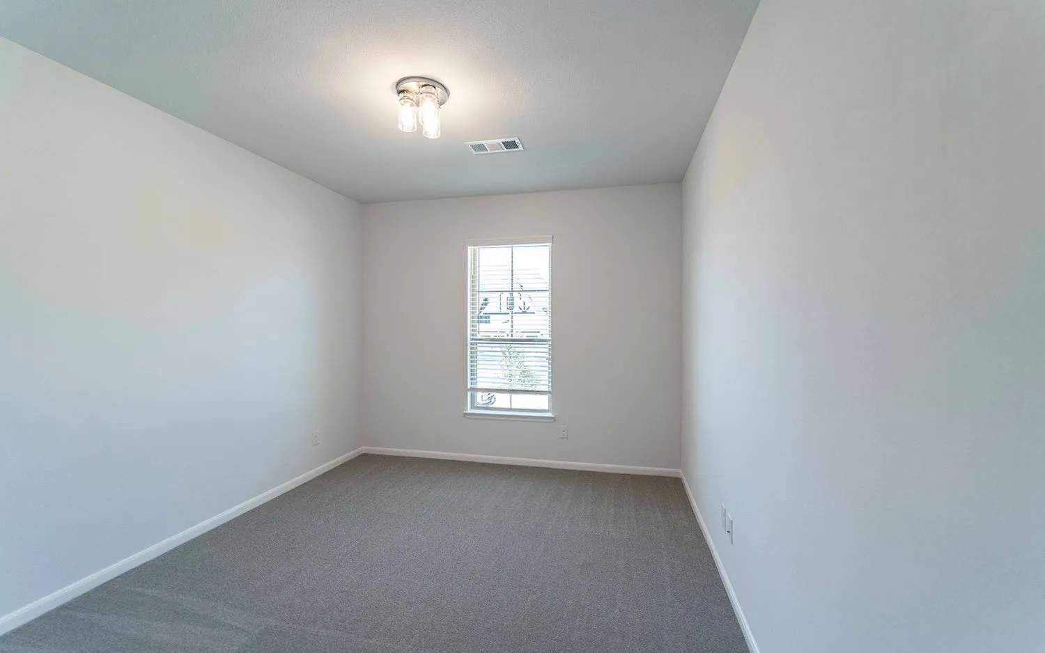 Neutral paint palette with a single window featuring horizontal blinds
