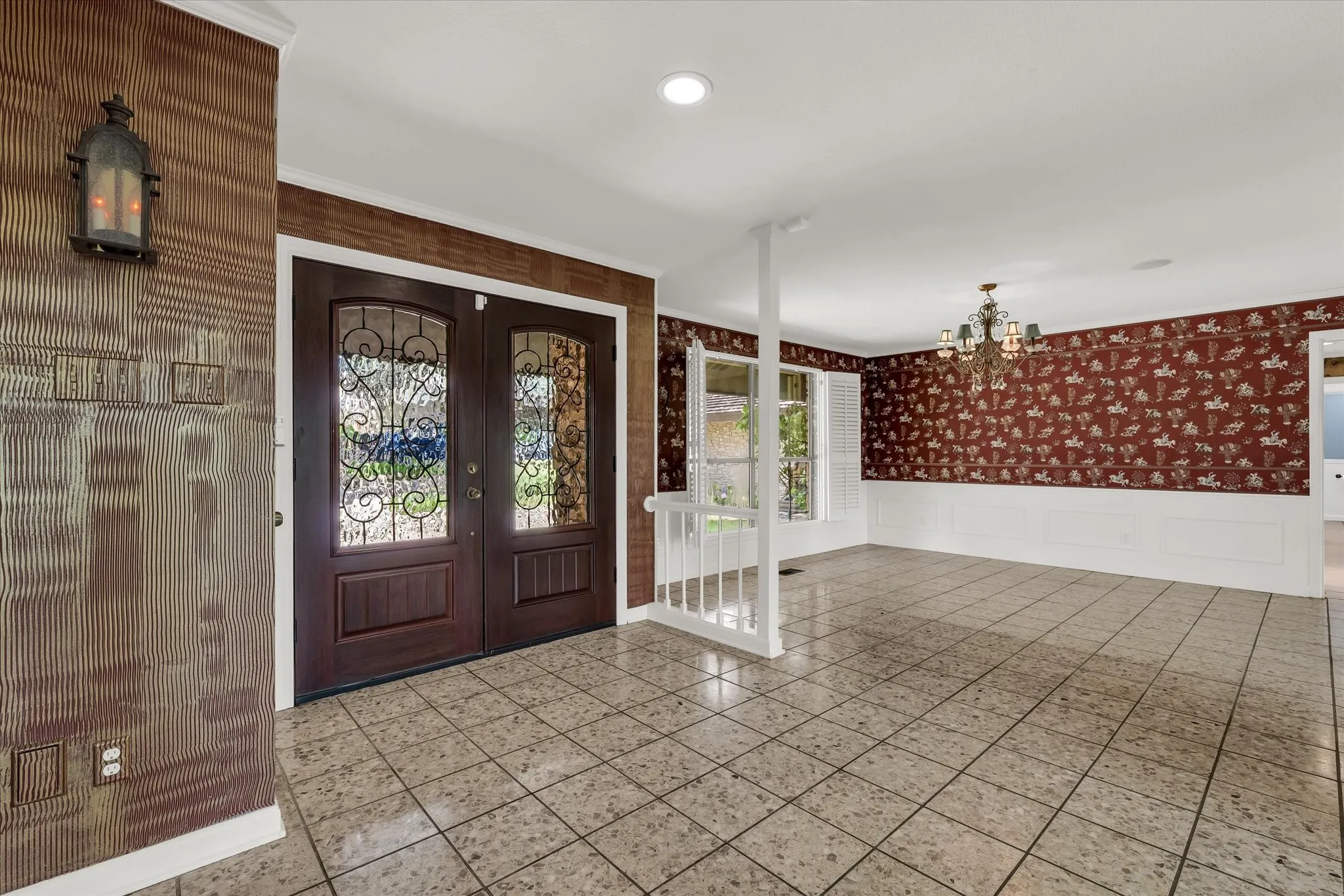 Double entry doors with decorative glass panels