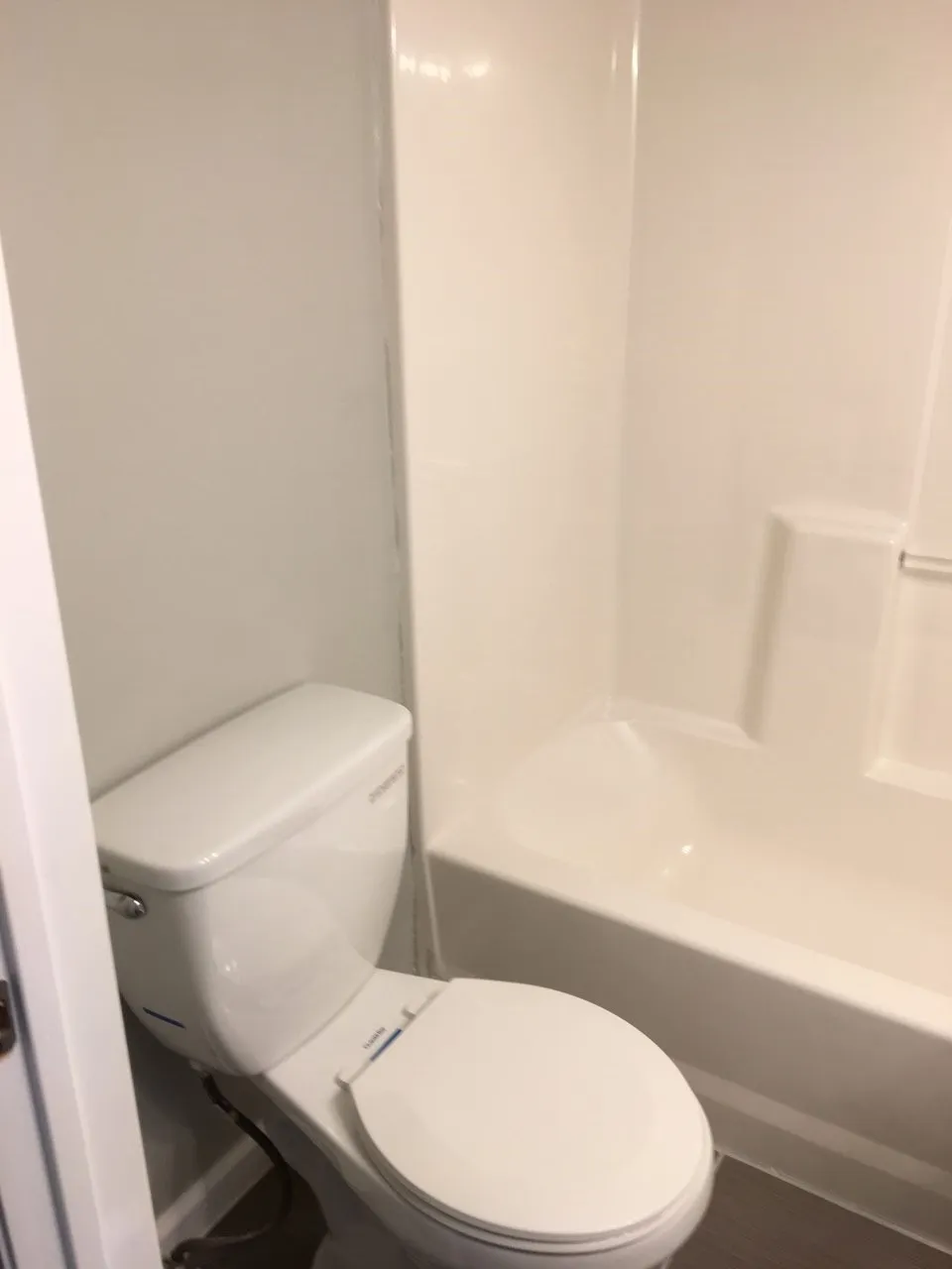 Bathroom featuring toilet and tub / shower combination