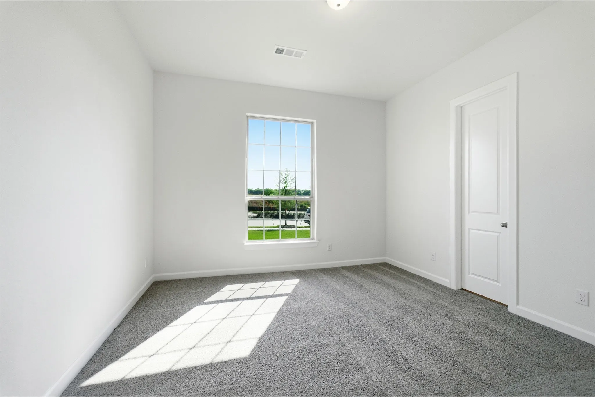 Room featuring neutral gray carpeting and white walls