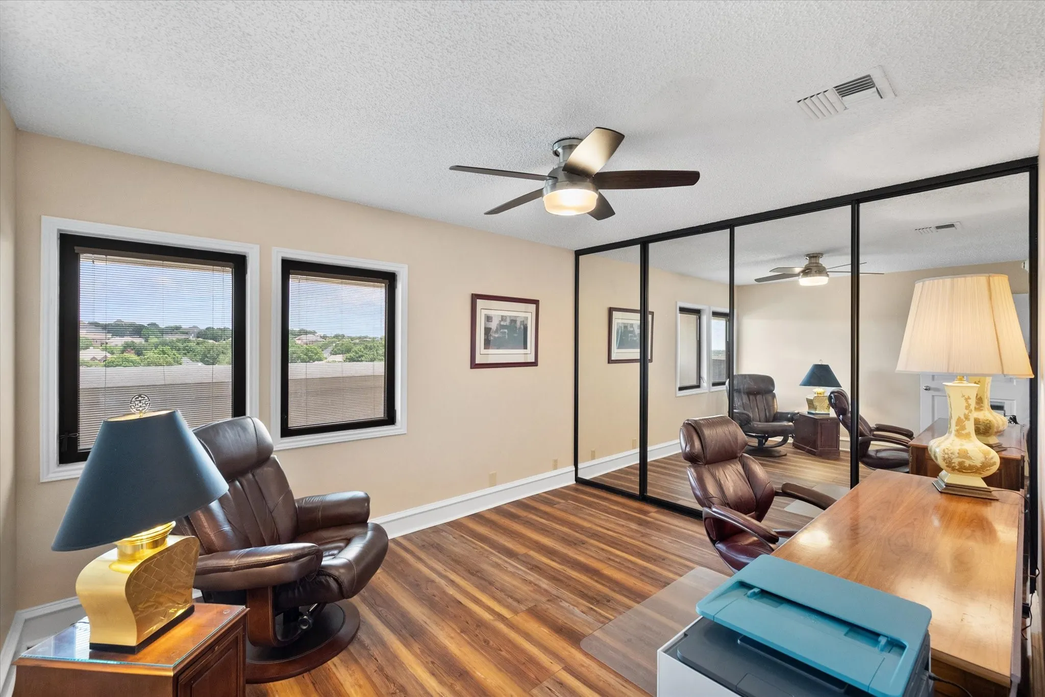 Secondary bedroom has a large closet with mirrored sliding doors.