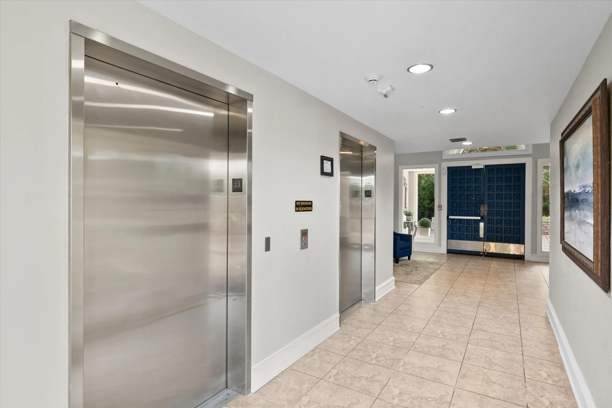 Downstairs lobby with two elevators
