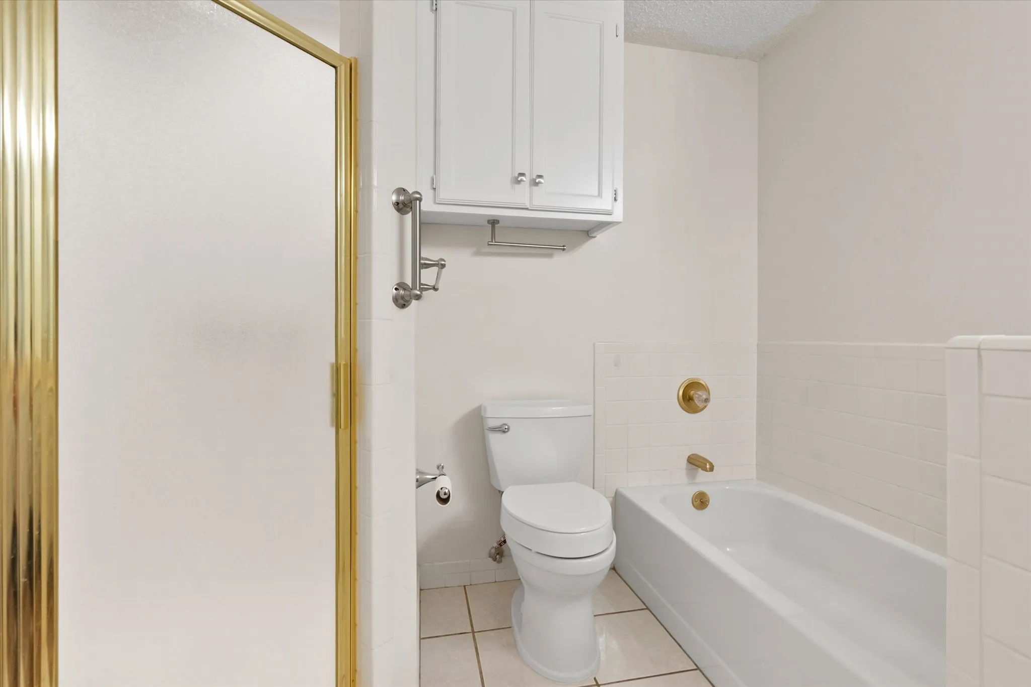 Primary bathroom with a separate shower and bathtub.