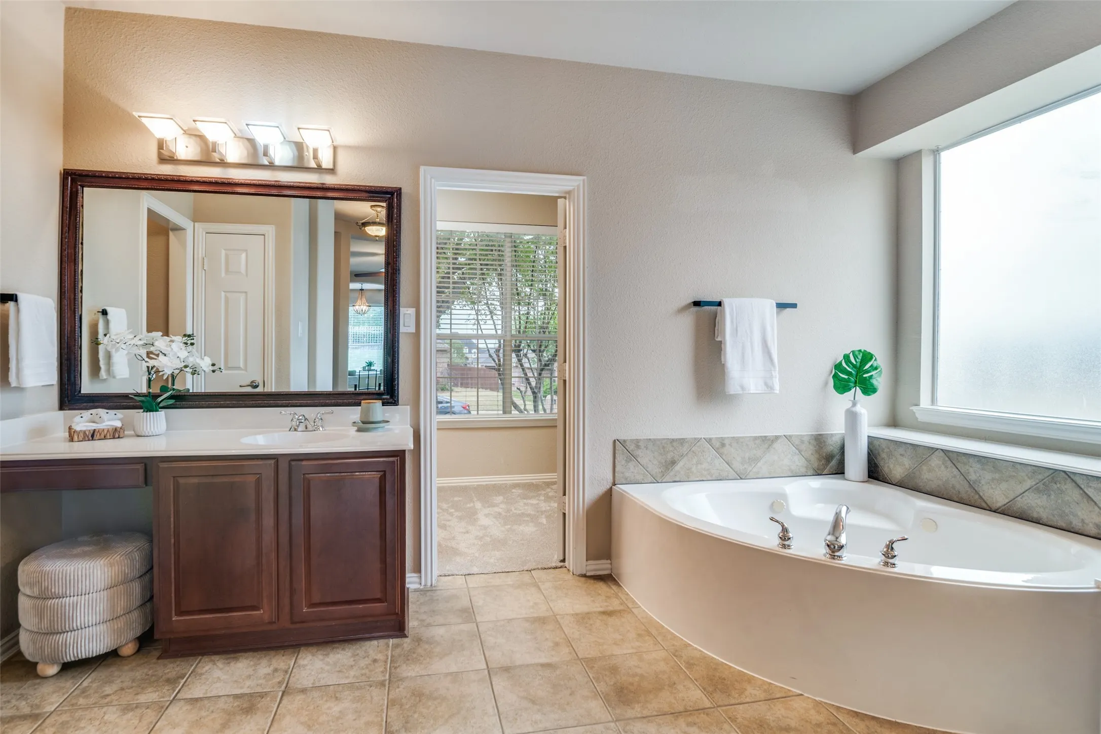 Two seperate vanities in the Master Bathroom