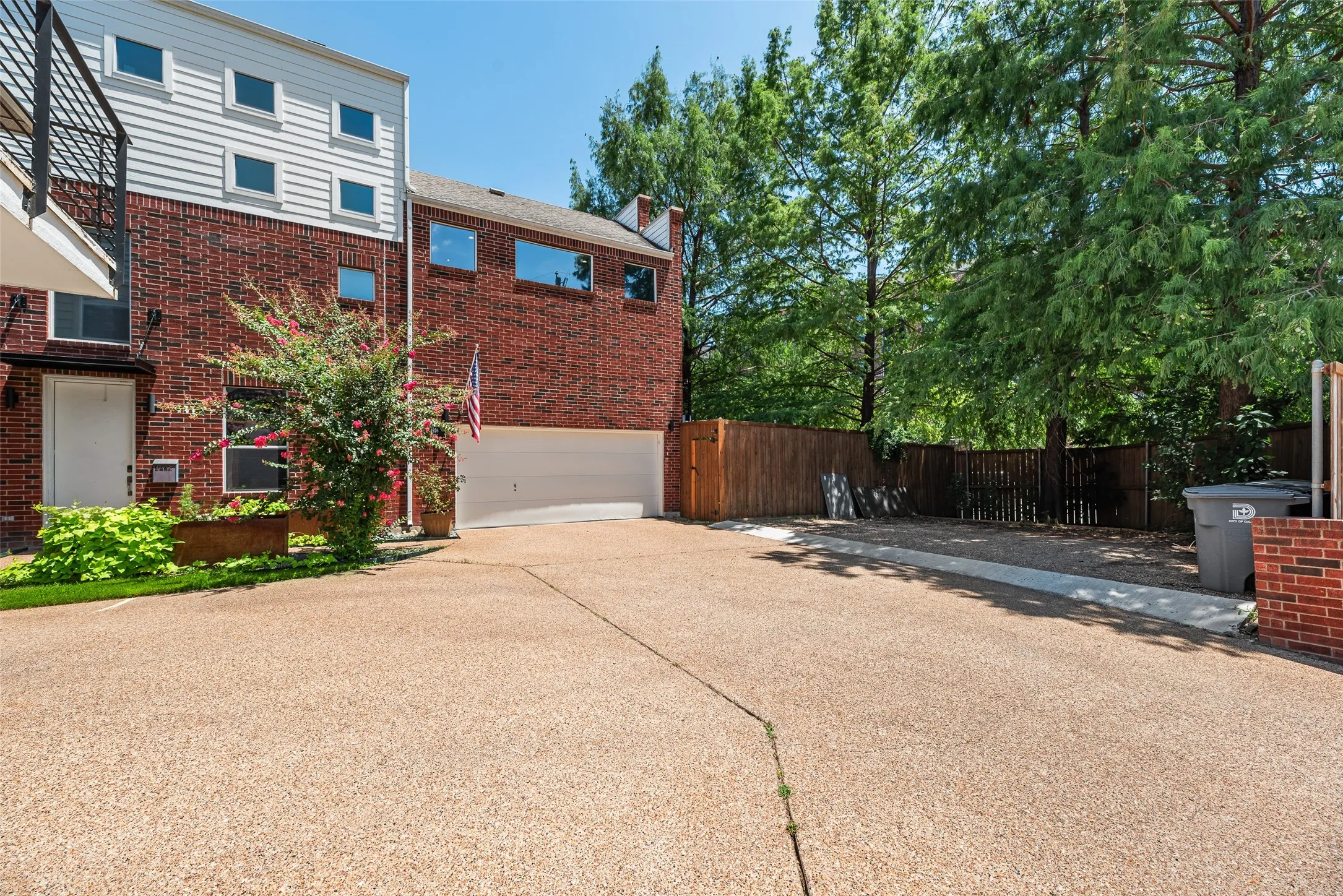 Brick and siding exterior with a two-car garage