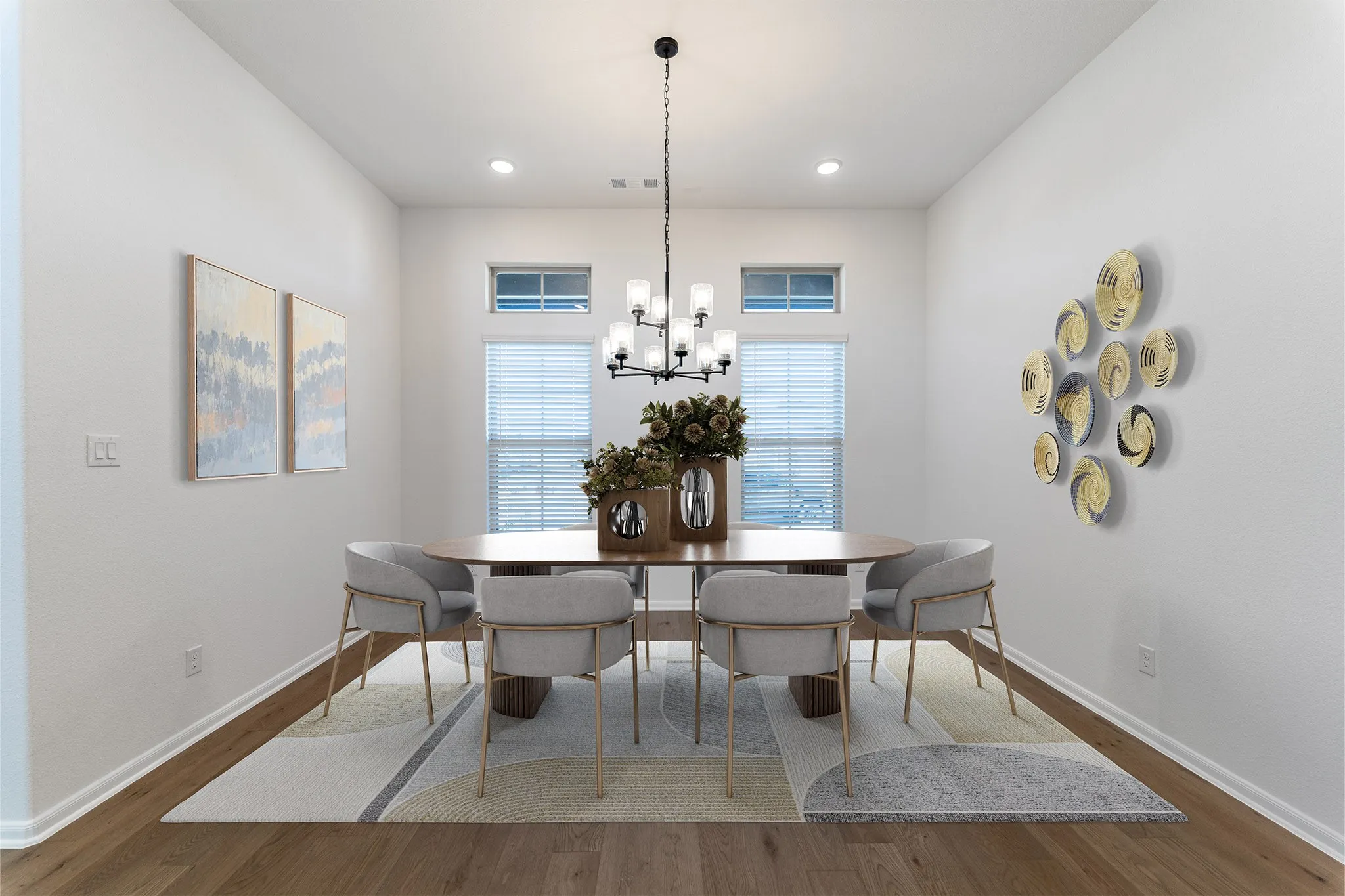 Dining area featuring wood-finish flooring and a contemporary chandelier