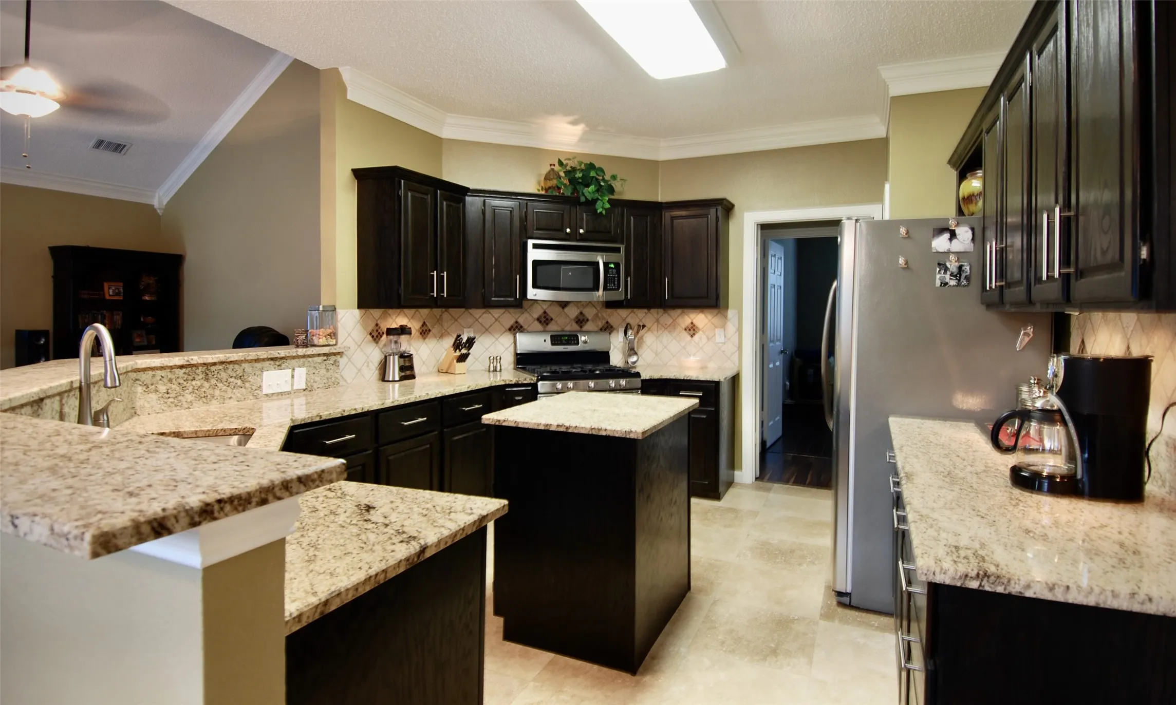 Beautiful Kitchen with Granite Counter Tops & Abundant Cabinets