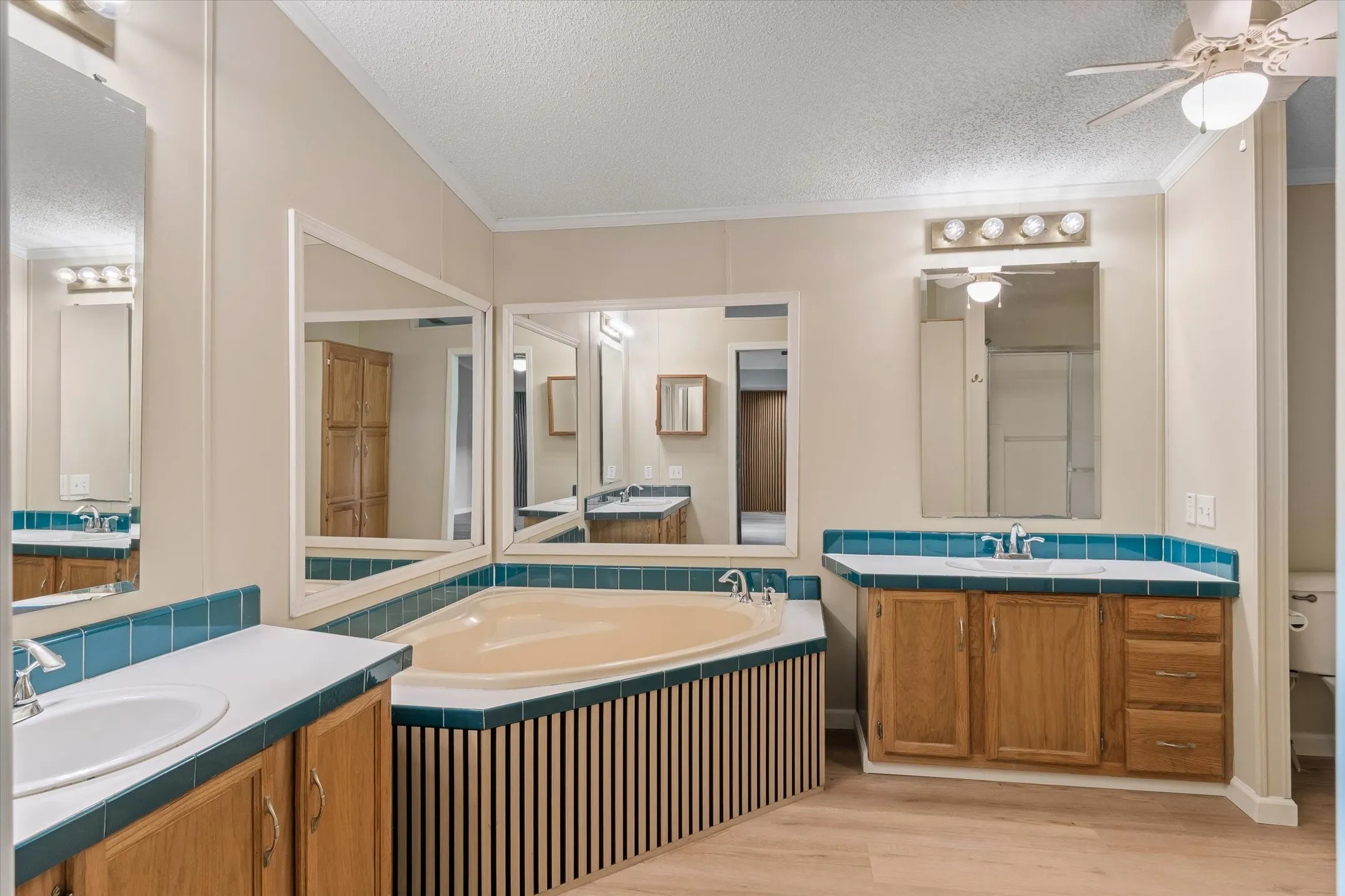 Primary Bathroom, separate dressing areas, with walk in closet.