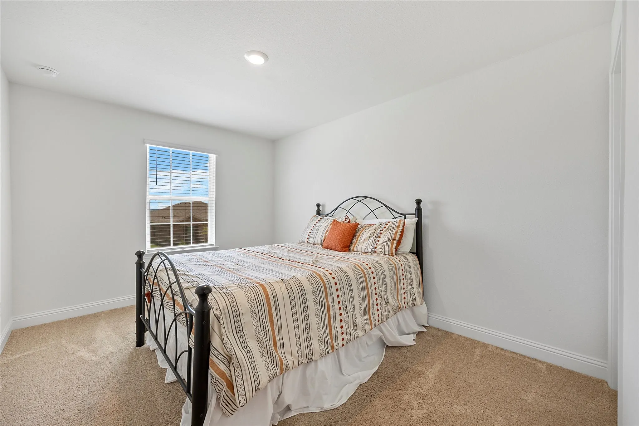 Auxiliary bedroom features roomy closet
