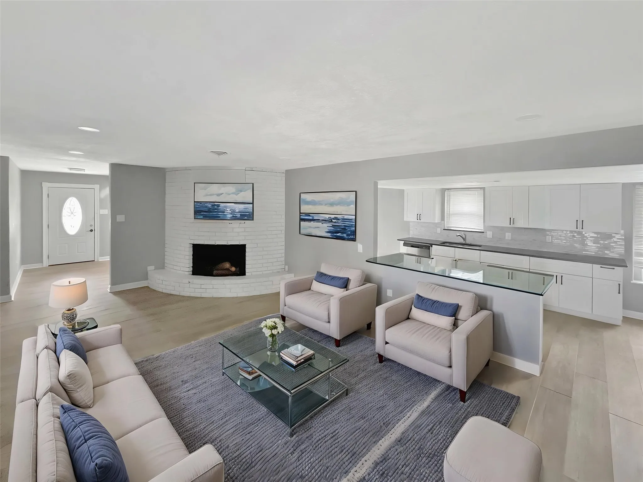 Virtually staged
Open-concept living area featuring light wood-finish flooring