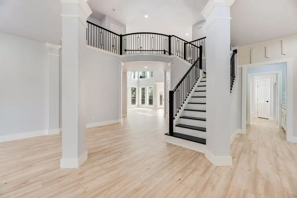 Dramatic staircase with custom railing