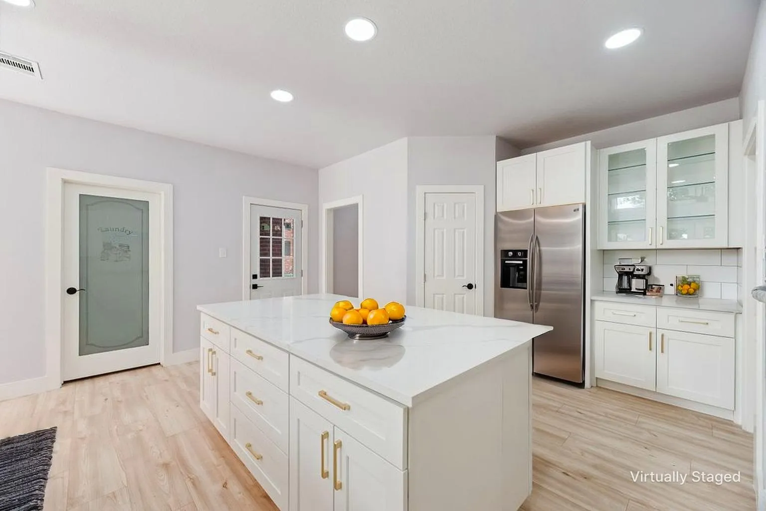 Gorgeous updated kitchen with spacious island complete with quartz countertop