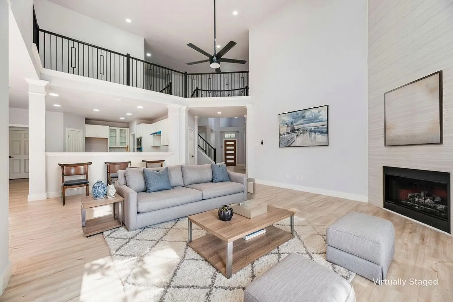 Vaulted ceilings with a ceiling fan, recessed lighting, and wood-finish flooring