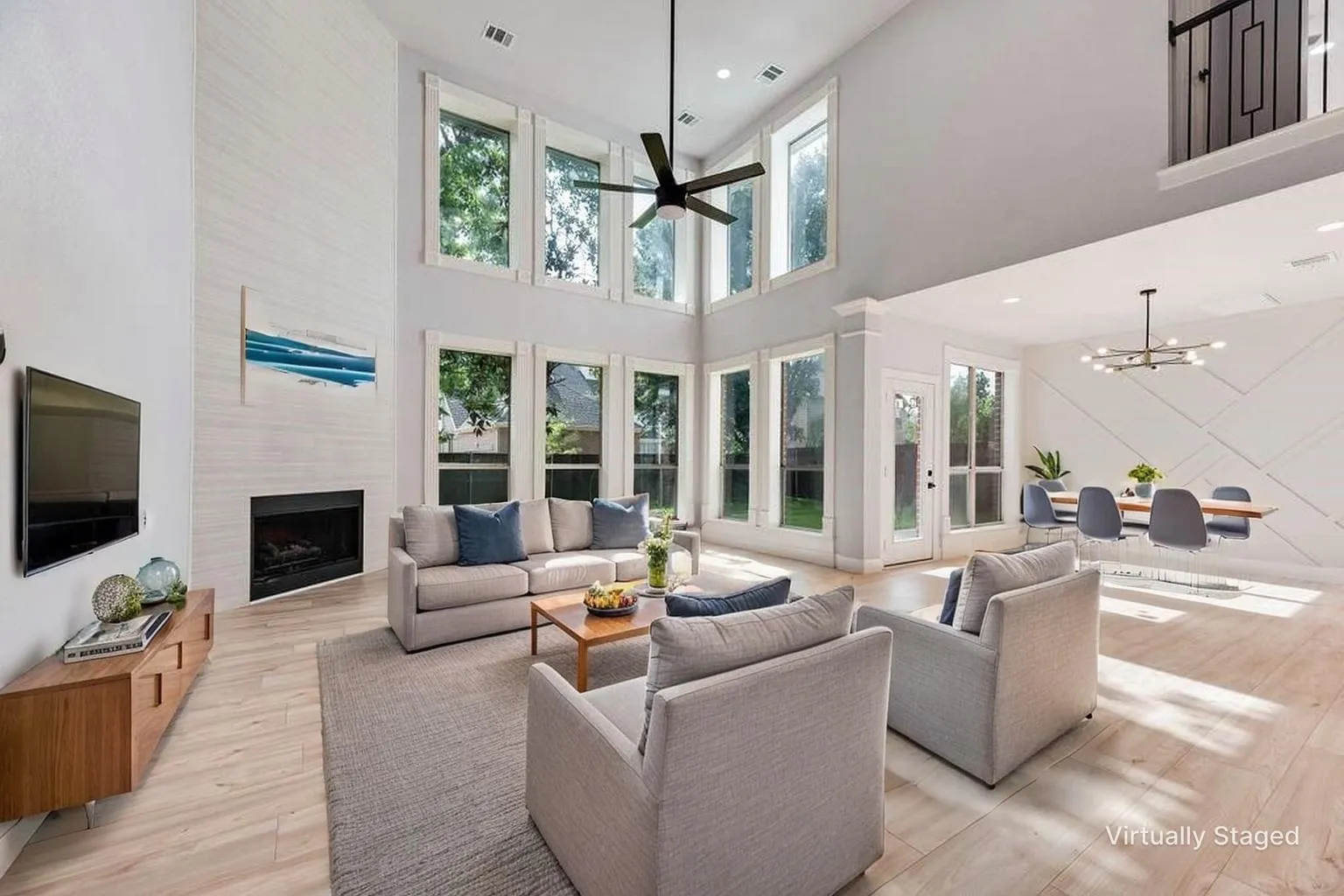 Gorgeous family room with soaring windows giving abundant natural light