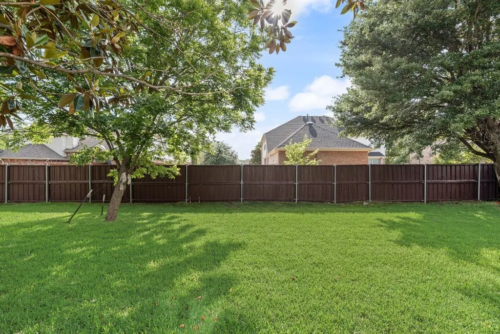 Mature shade trees, lush green lawn