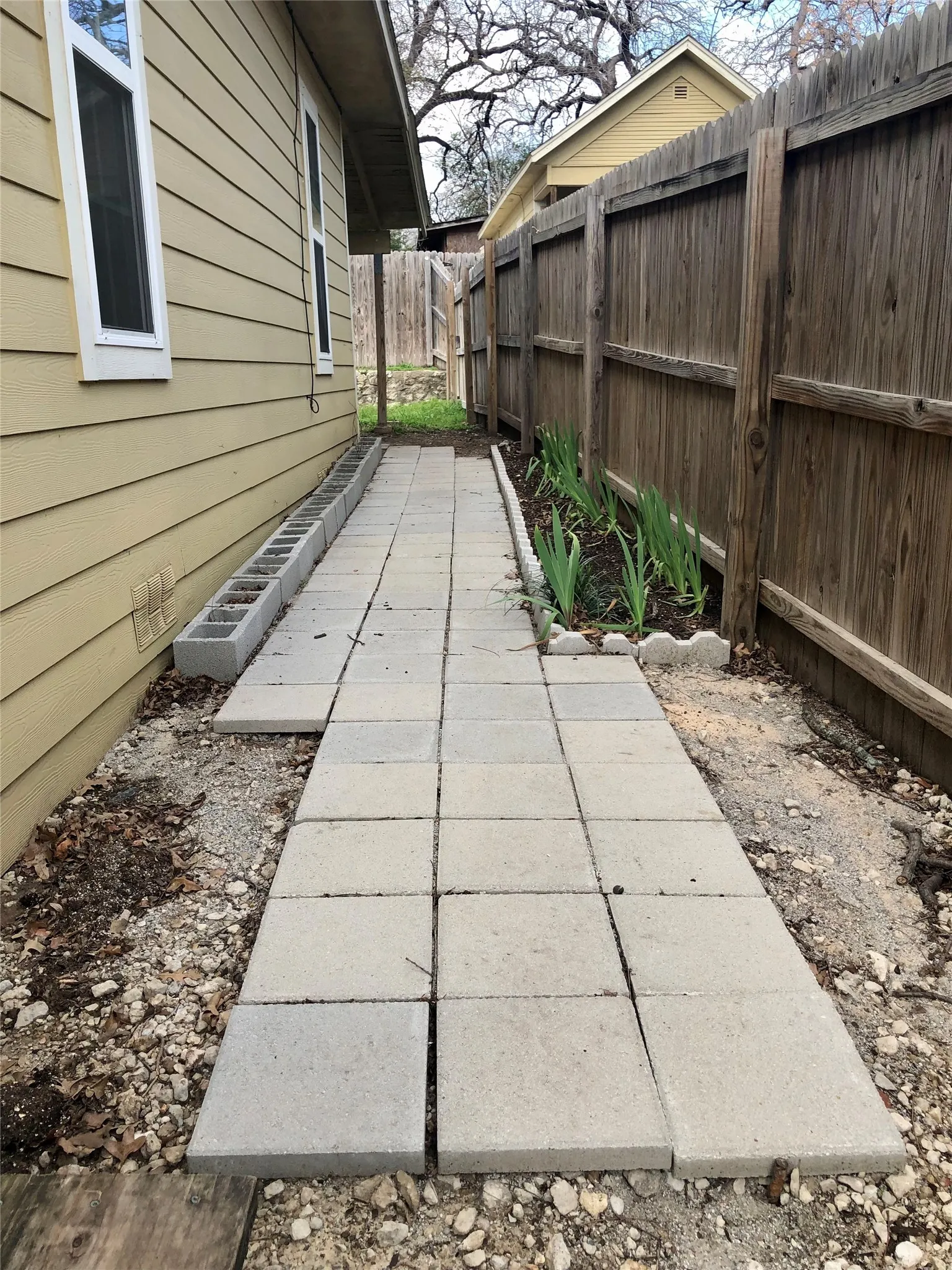 Side yard, to can walk into the backyard without entering the house