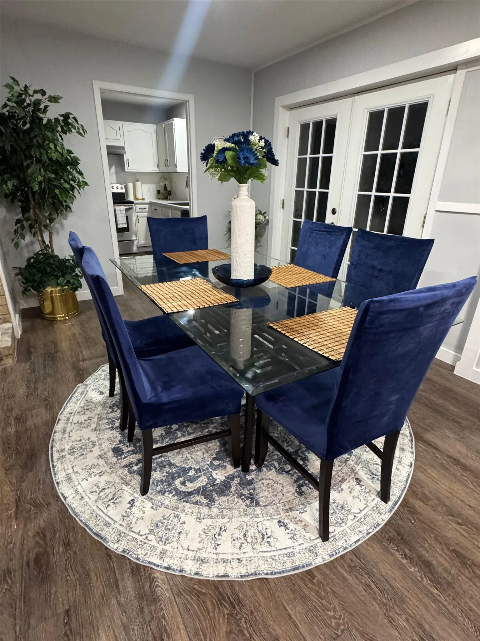 Dining area featuring wood-finish flooring and light gray walls