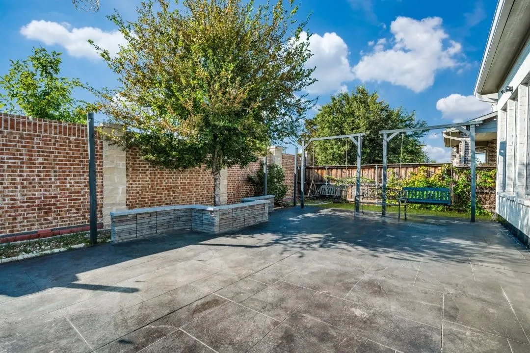 Expansive outdoor patio featuring large-format tile flooring